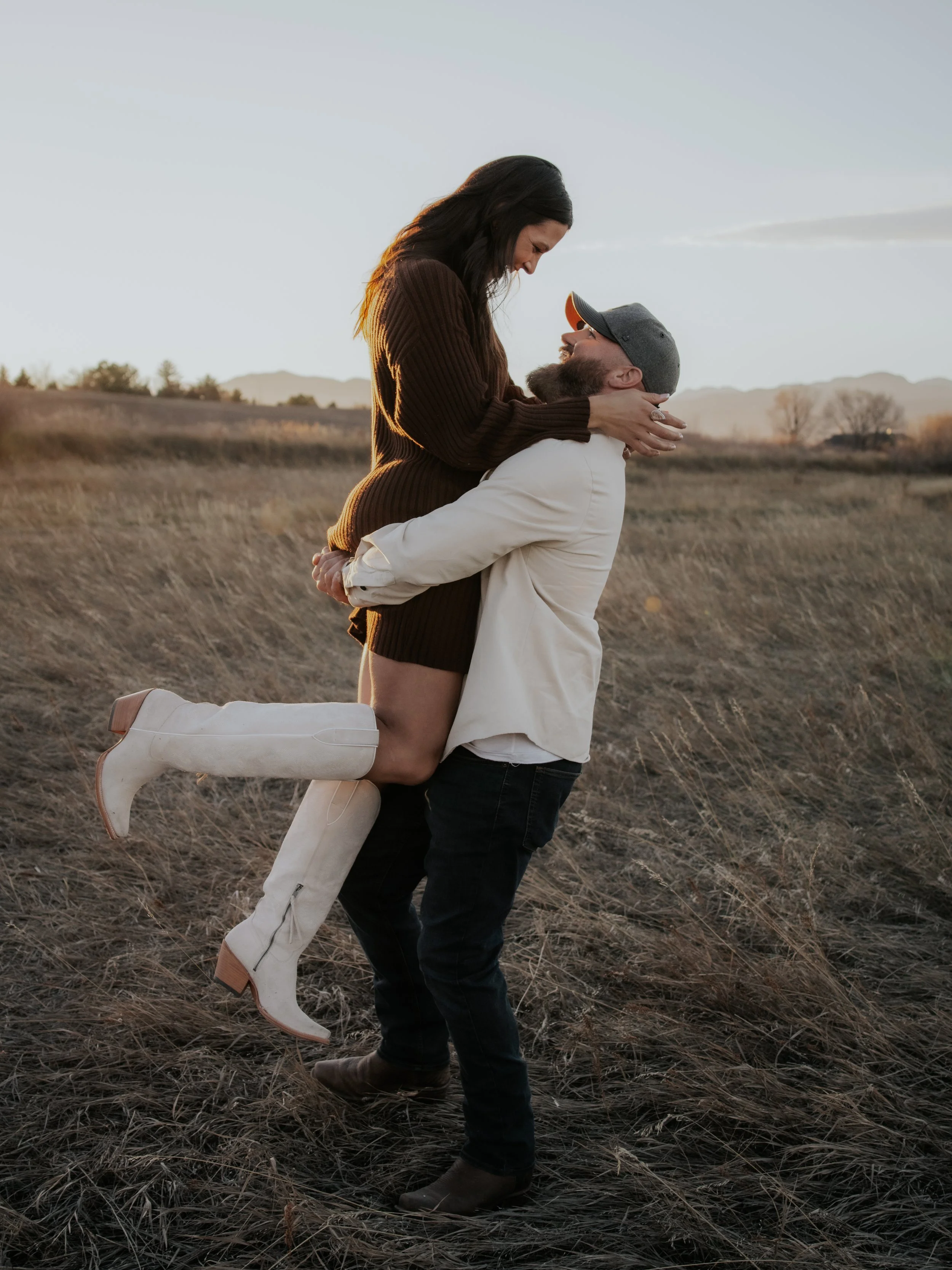 Couple having their engagement photo  taken by Kiela Rain Photography