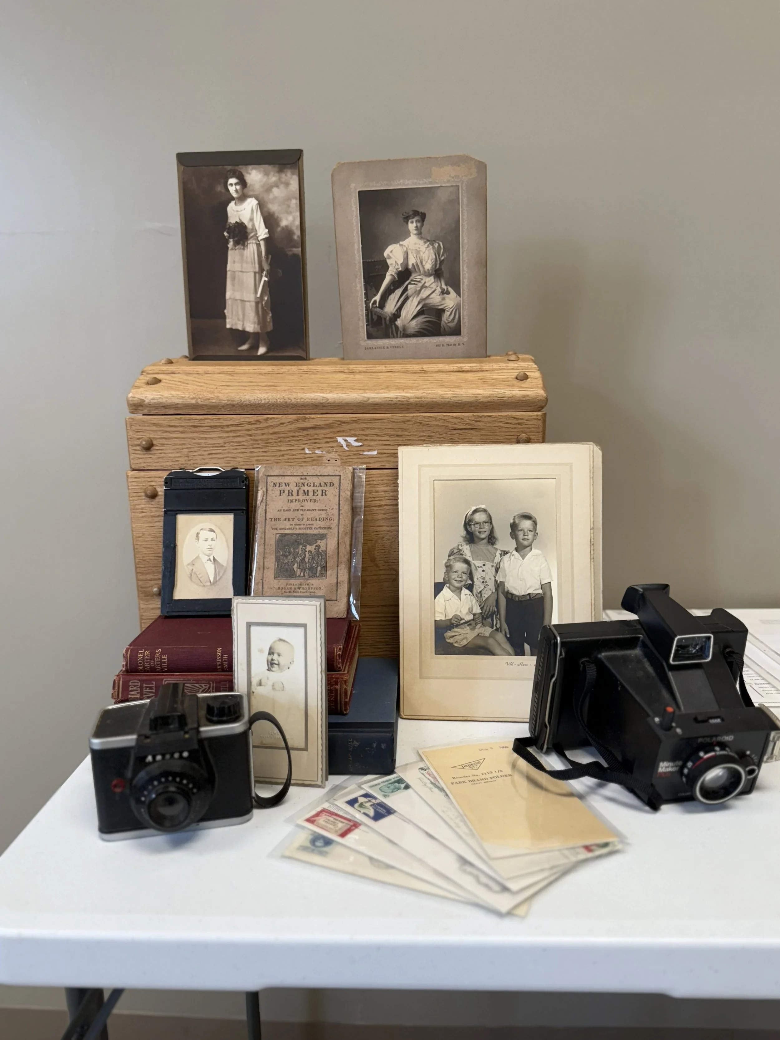 The Mobile Museum includes old cameras, family photographs, letters, books, and other artifacts to tie children to the past.
