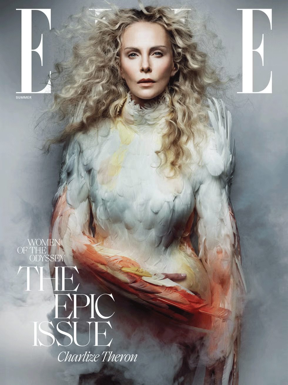 The cover of Elle magazine featuring Charlize Theron with voluminous curly hair, wearing a feathered and textured outfit, with the text 'Women of the Odyssey: The Epic Issue'.