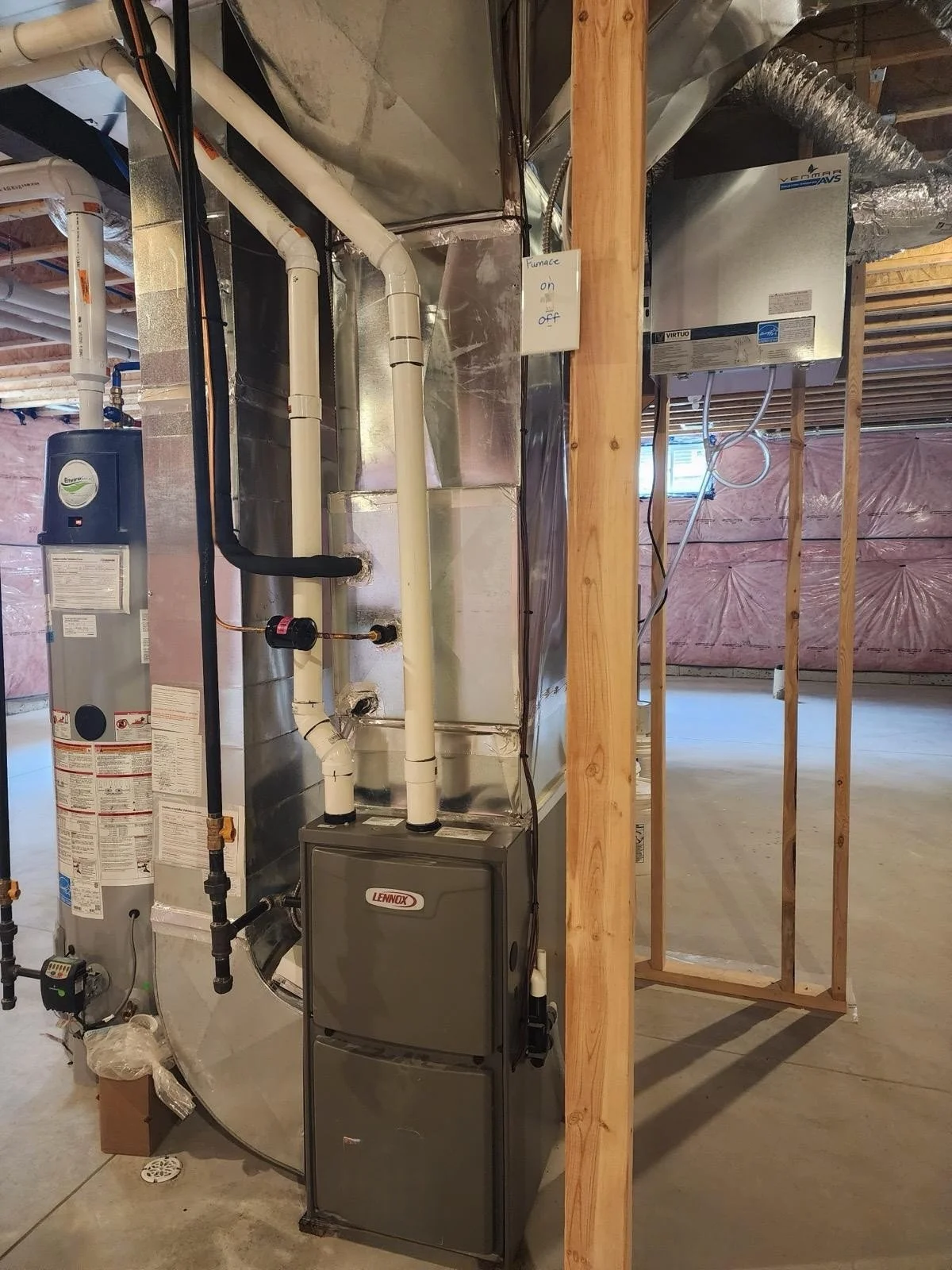 Basement with HVAC equipment, including a Lennox furnace, ductwork, and a humidifier, with unfinished walls and ceiling.