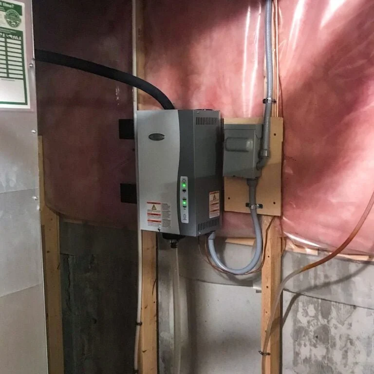 Electrical or electrical panel installed on a wall in a utility area with wiring and a circuit box.