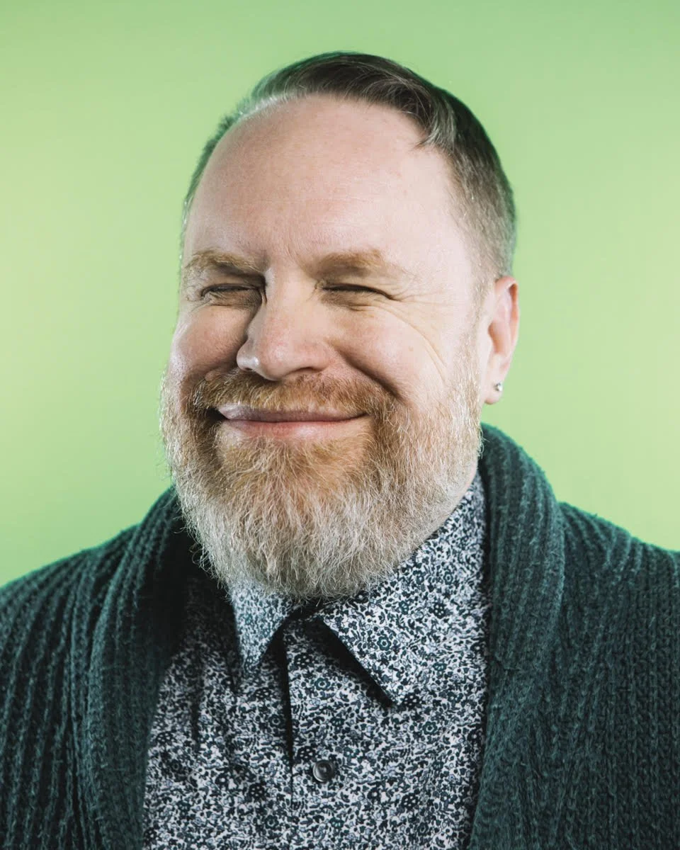 Andy is white. He has a full beard which is gray and red. A little bit of salt and cayenne pepper, if you will.