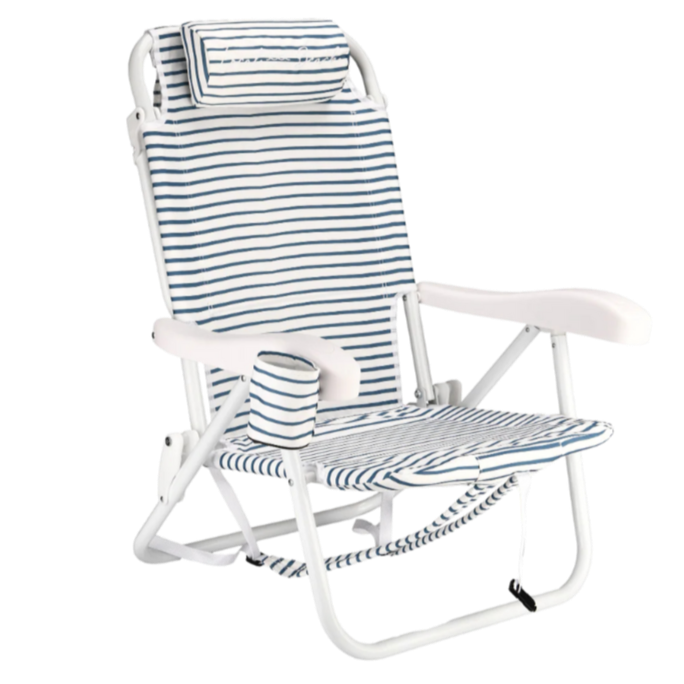 A white beach chair with blue and white striped fabric and a matching striped pillow.