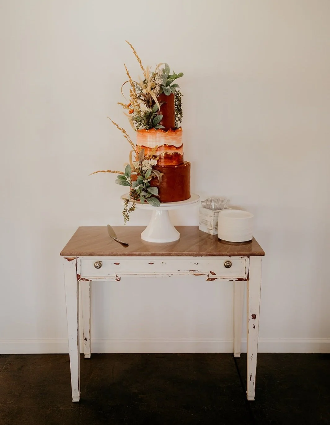 (1) distressed white marble top table