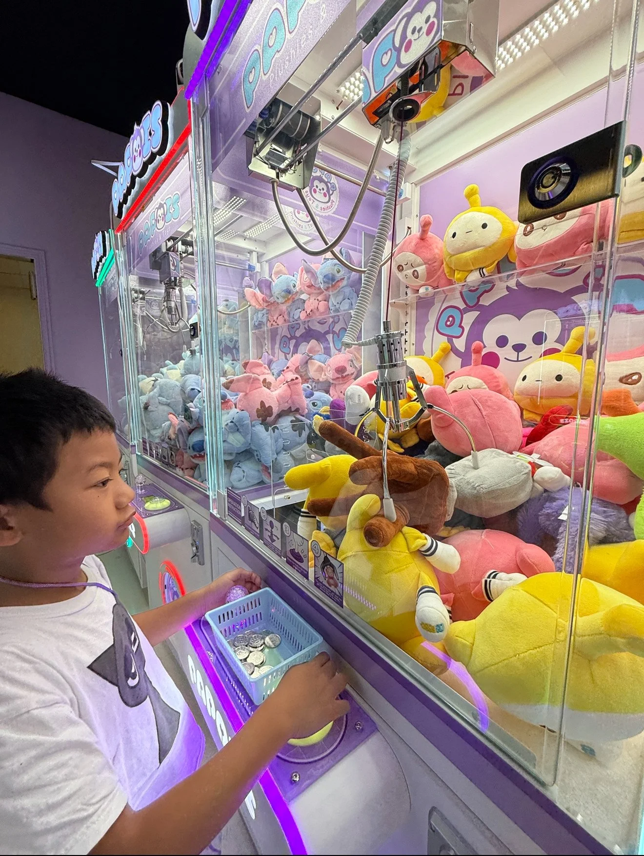 Boy with a claw machine