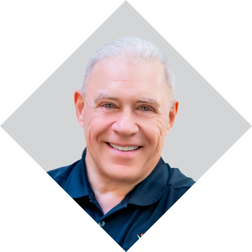 Headshot of Daniel Mueller, leadership author and coach, smiling and wearing a dark polo shirt against a light geometric background.