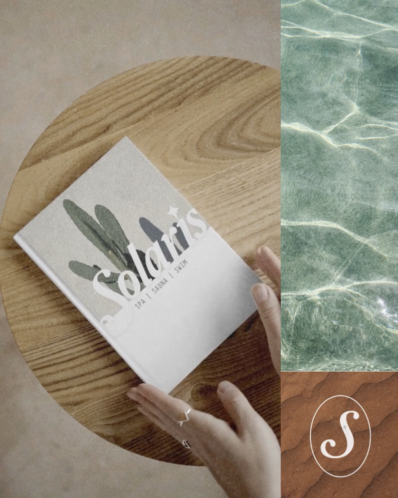 A person holding a brochure on a round wooden table. The brochure has the text 'Soldaris' and 'Spa, Sauna, Swim' with a cactus illustration. Two abstract background textures, one green and one brown, are partially visible on the right side.