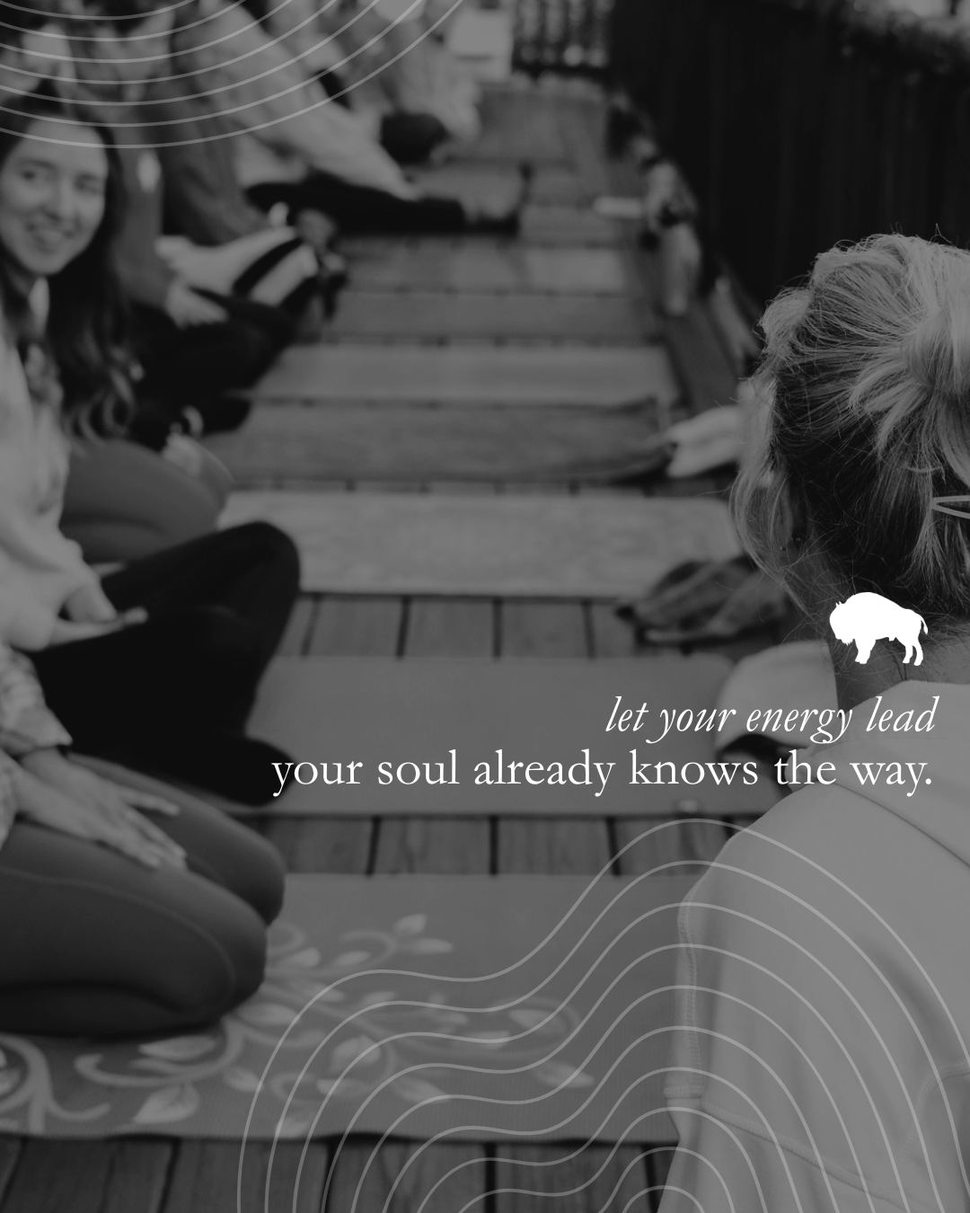People sitting cross-legged on yoga mats on a wooden deck, engaged in a meditation or breathing session. Text overlay reads, 'let your energy lead your soul already knows the way,' with a small buffalo icon.