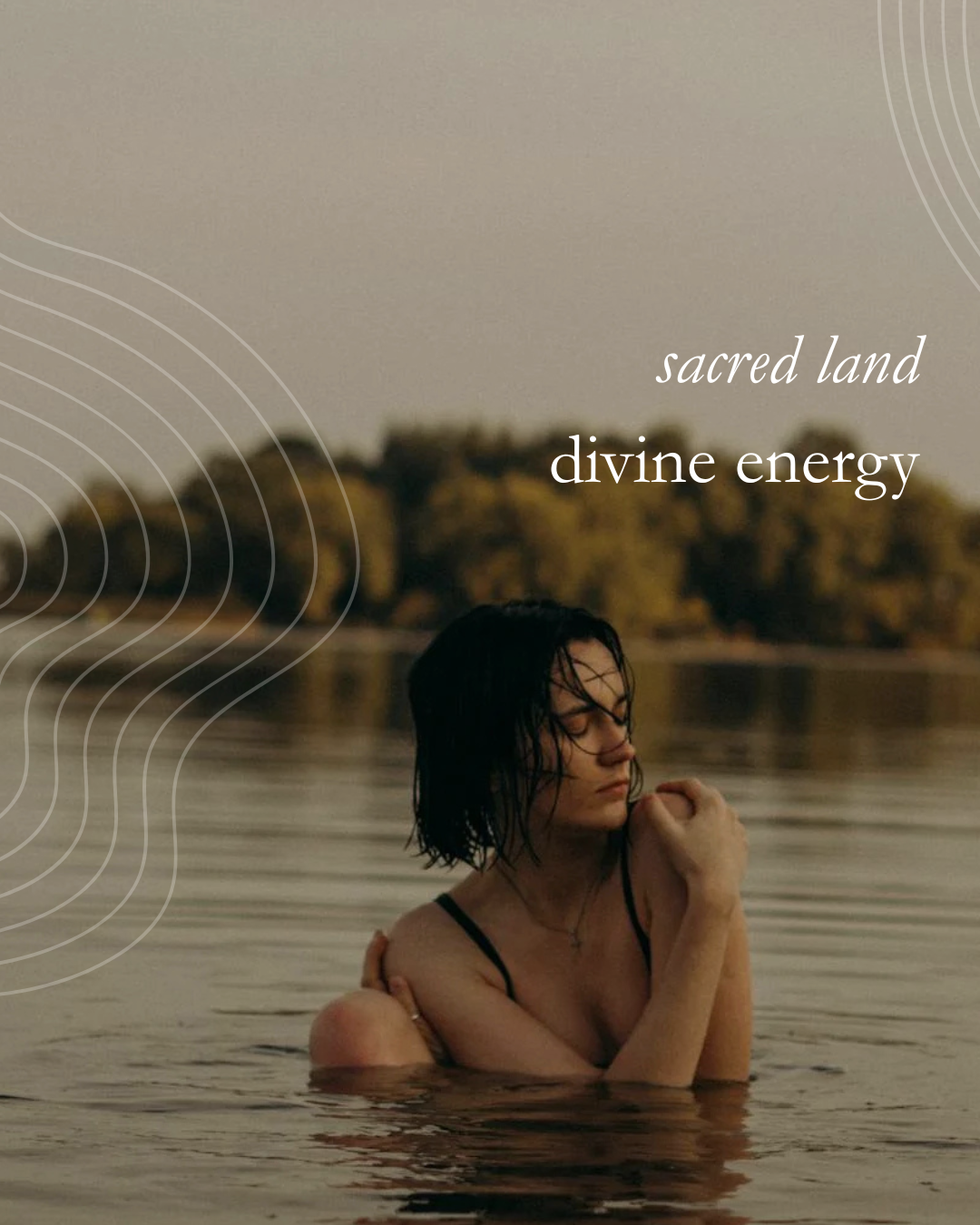 A woman with wet hair sitting in a body of water with trees in the background, and text overlay that reads 'sacred land divine energy'.