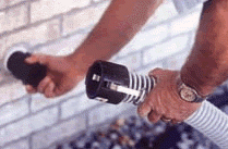 A person holding a flexible hose pipe.