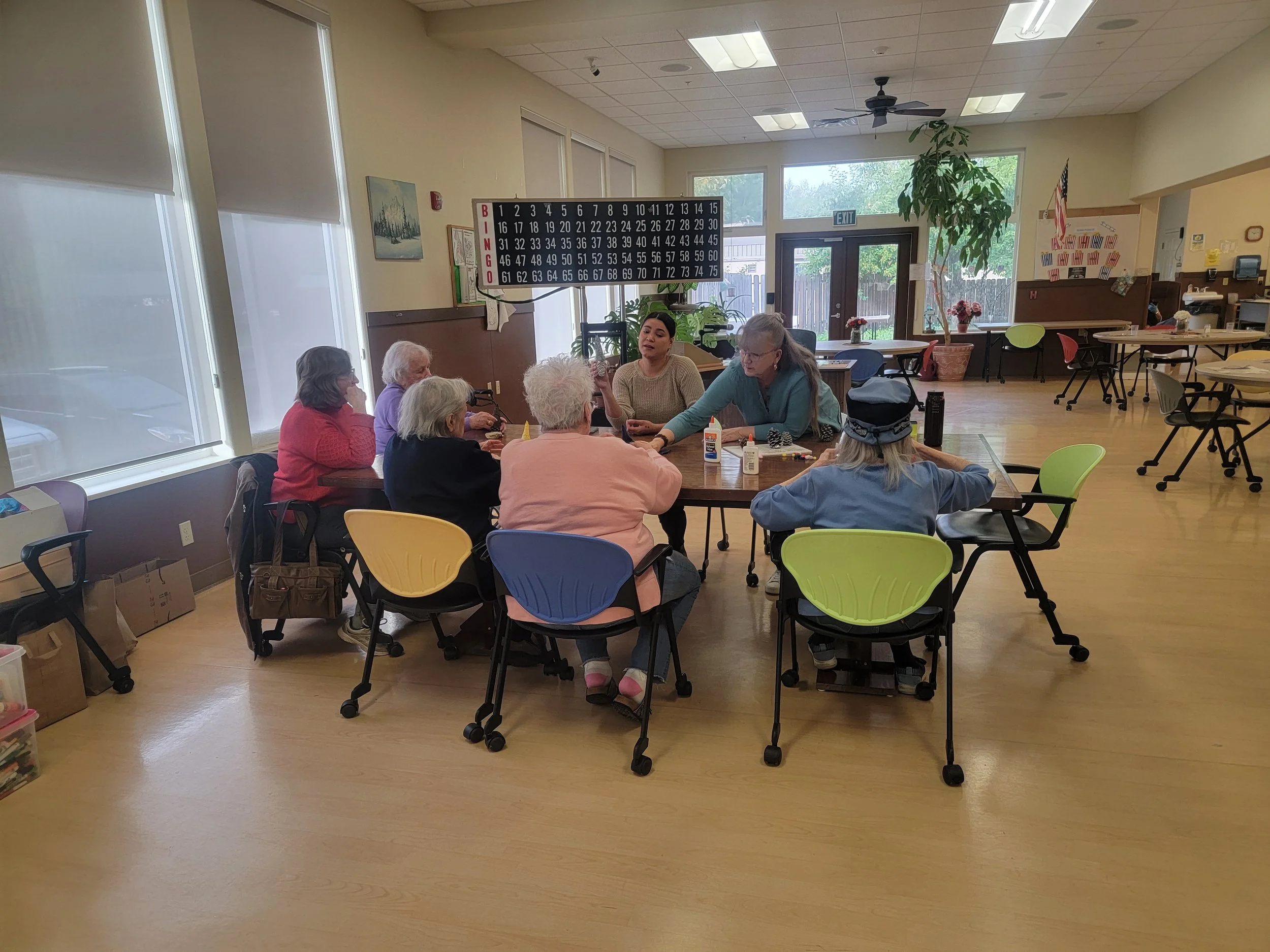 MatSu Senior Center Adult Day Services seniors playing a game of bingo.