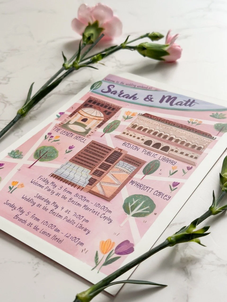A colorful illustrated event invitation for Sarah and Matt, decorated with drawings of Boston landmarks, surrounded by pink carnations on a white surface.