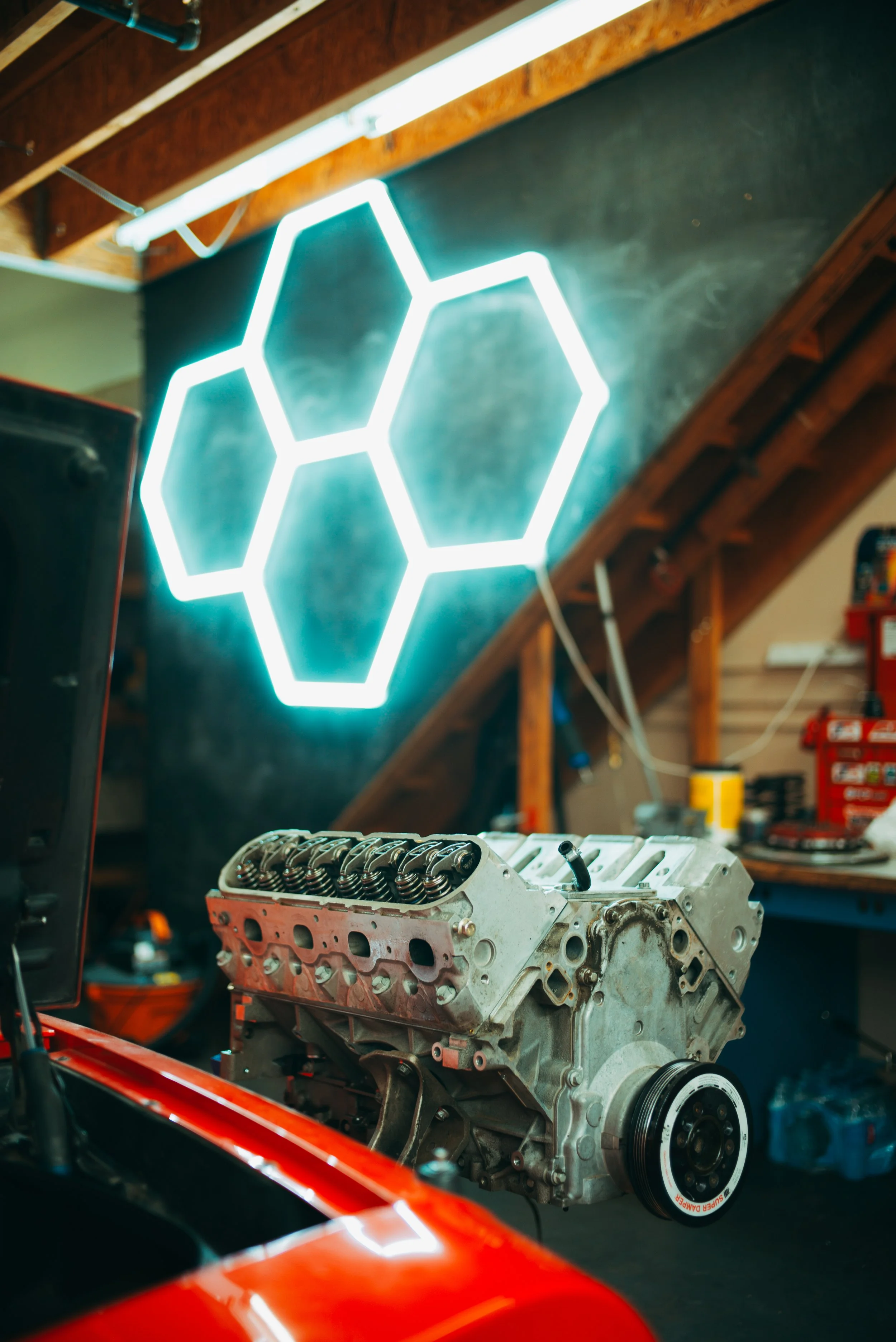 An LS1 motor on a stand as it is being actively worked on