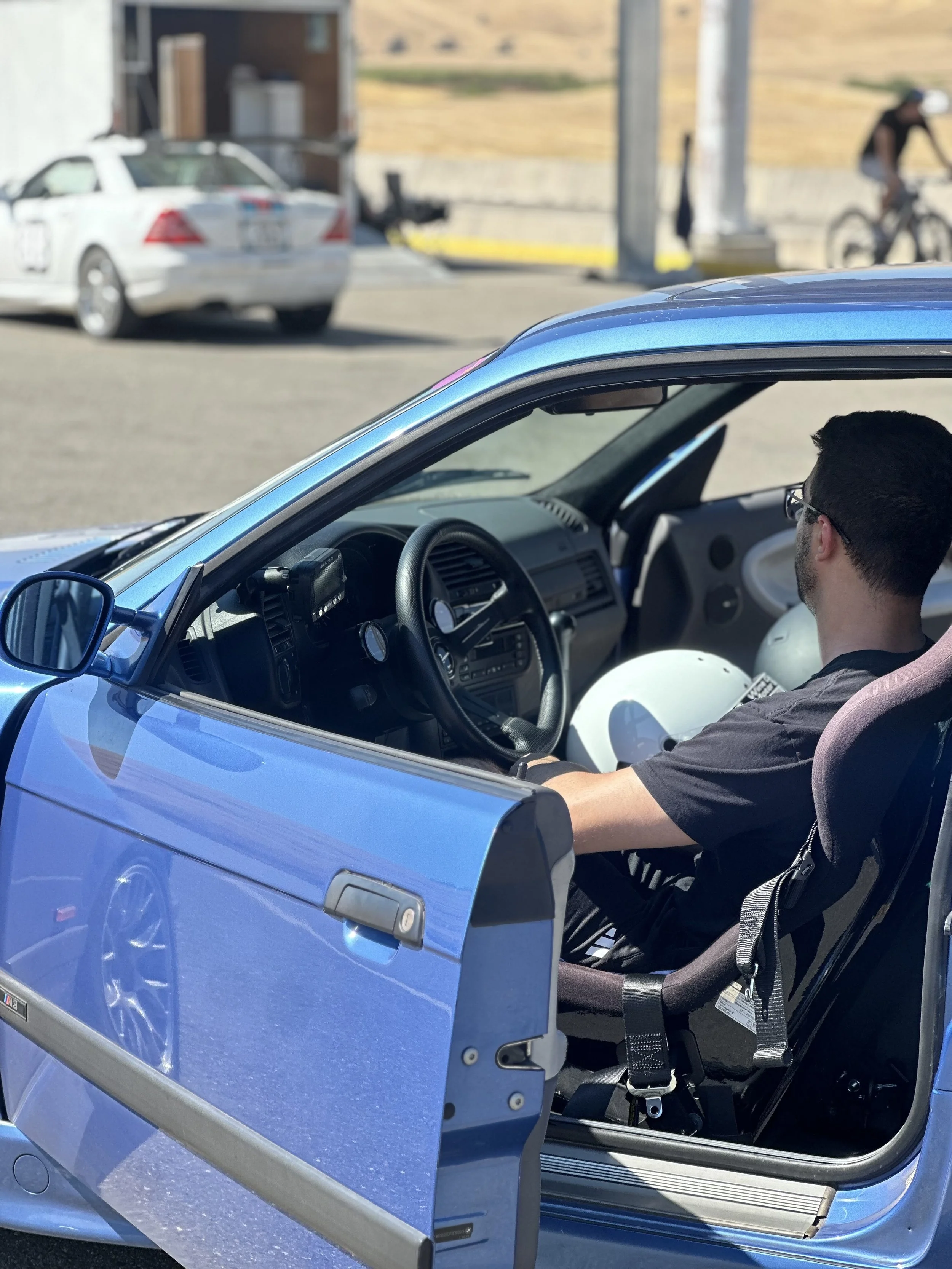 A client sits in their E36 M3 during a track day at Thunderhill West, and pushes their vehicle to the limits reliably.
