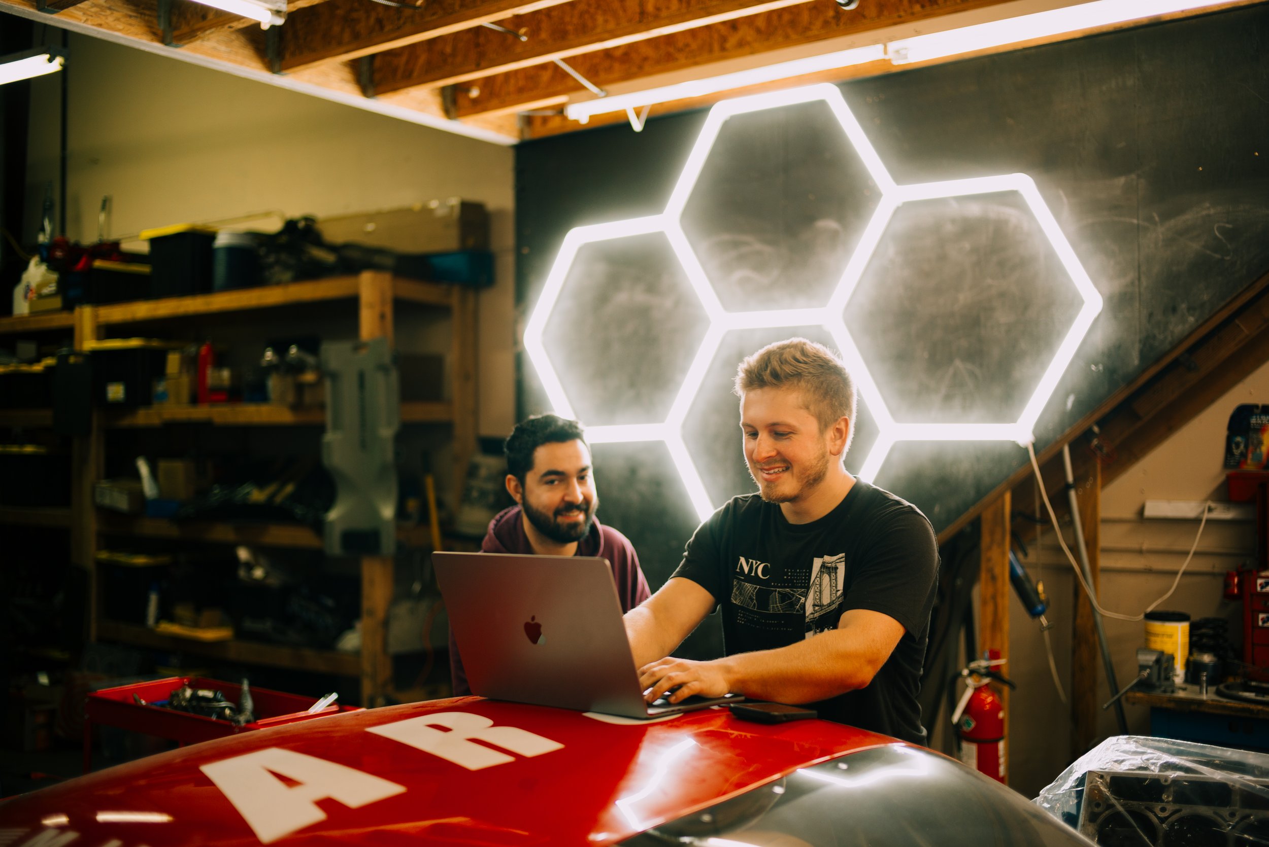 Our founder working with a customer to develop a racecar