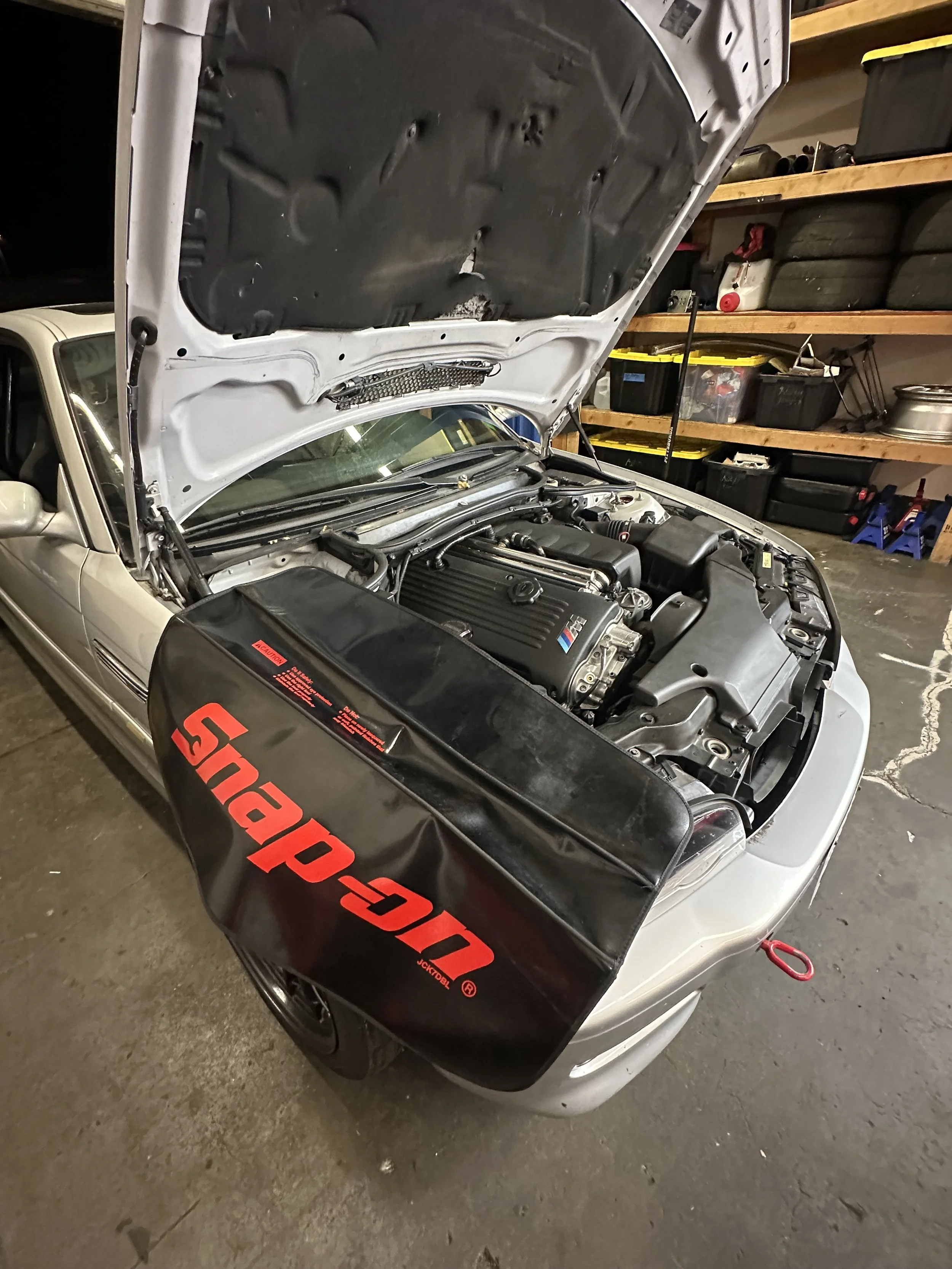 E46 M3 with its S54 motor in the shop for a valve adjustment as part of routine track maintenance