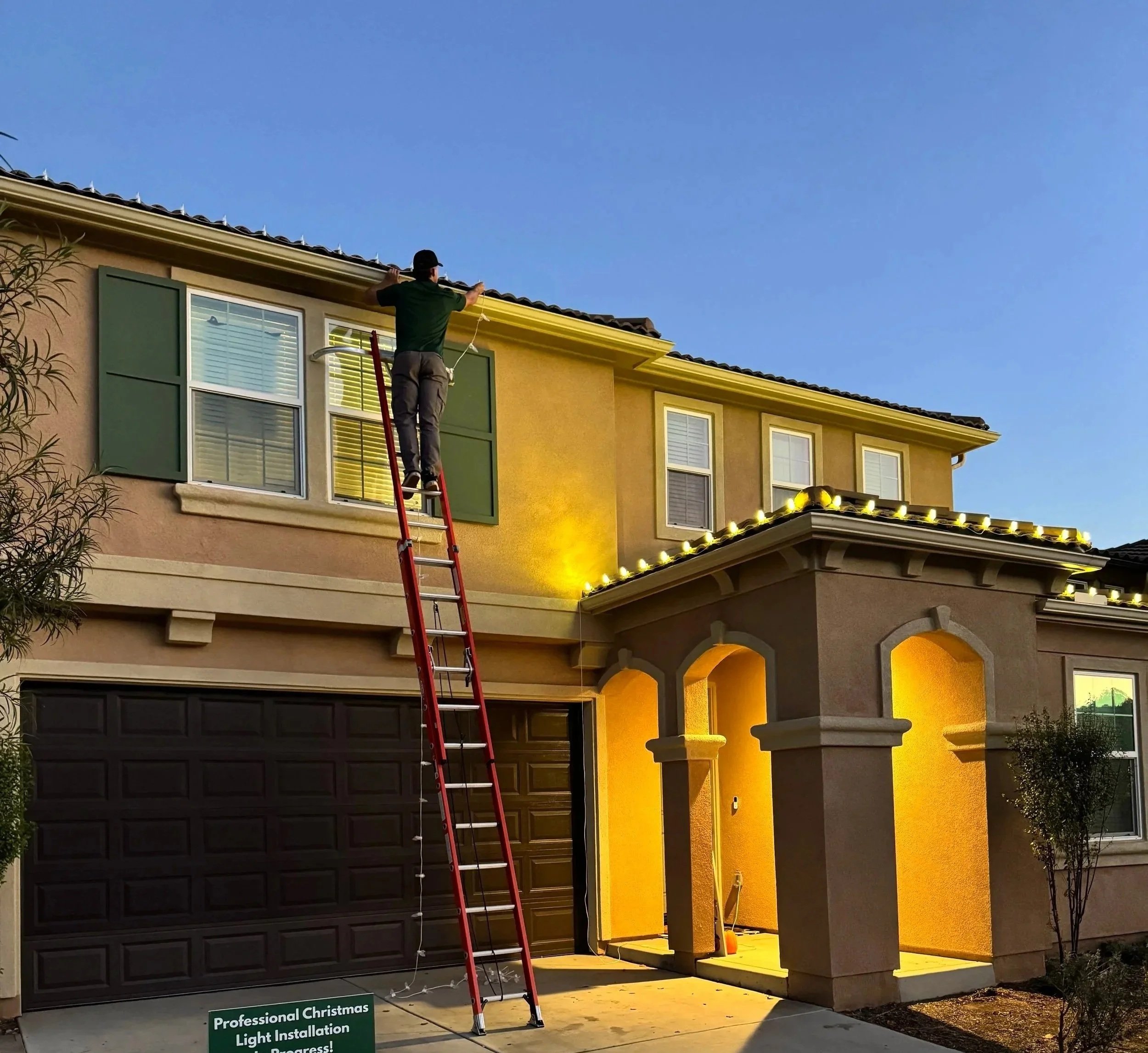 Hunter, founder of Crestline Holiday Lighting, on a job site
