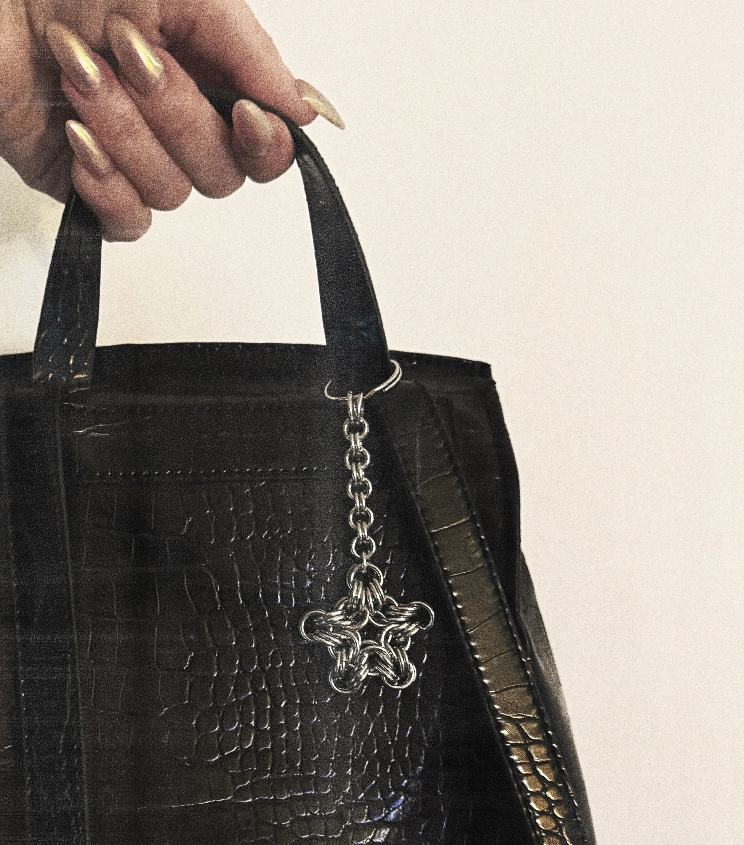 the etoile - just because it&rsquo;s a keychain doesn&rsquo;t mean it can&rsquo;t double as a bag charm ✨💫 (available via dm or maidencore.com) 🖤

#chainmail #chainmaille #chainmailfashion #shoplocalyvr #bagaccessories