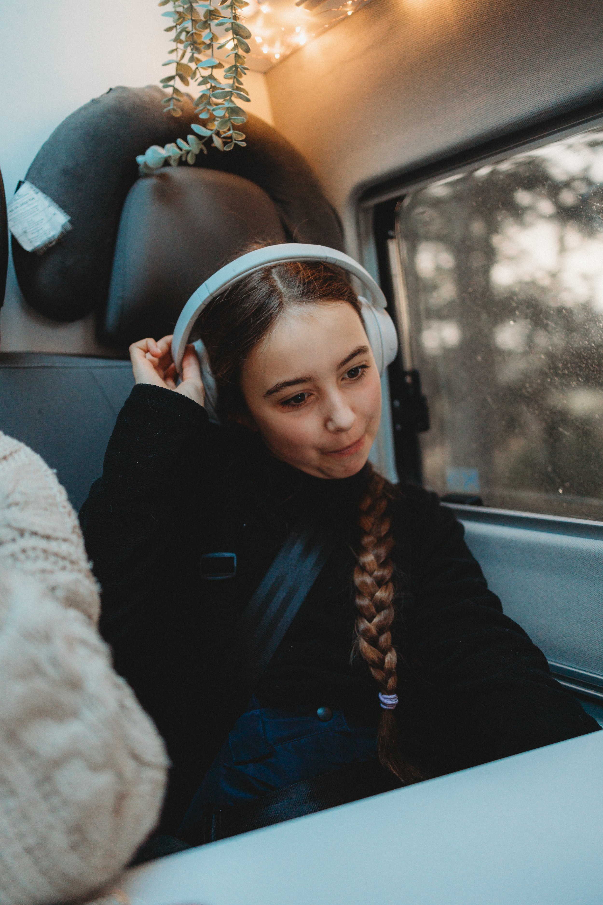 Children travelling in a campervan during winter