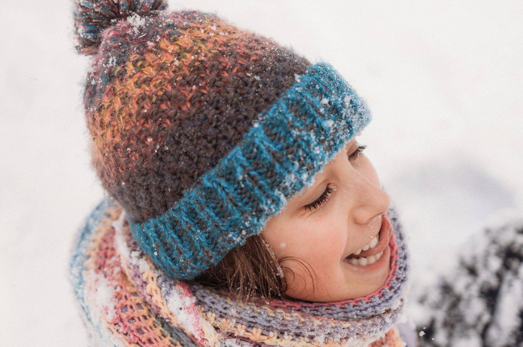 Children playing in the snow in a forest near Ullapool
