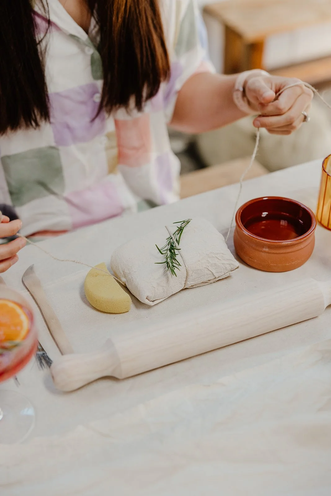 Mobile pottery hens party setup at a Perth Airbnb with clay tools and decorated tables.