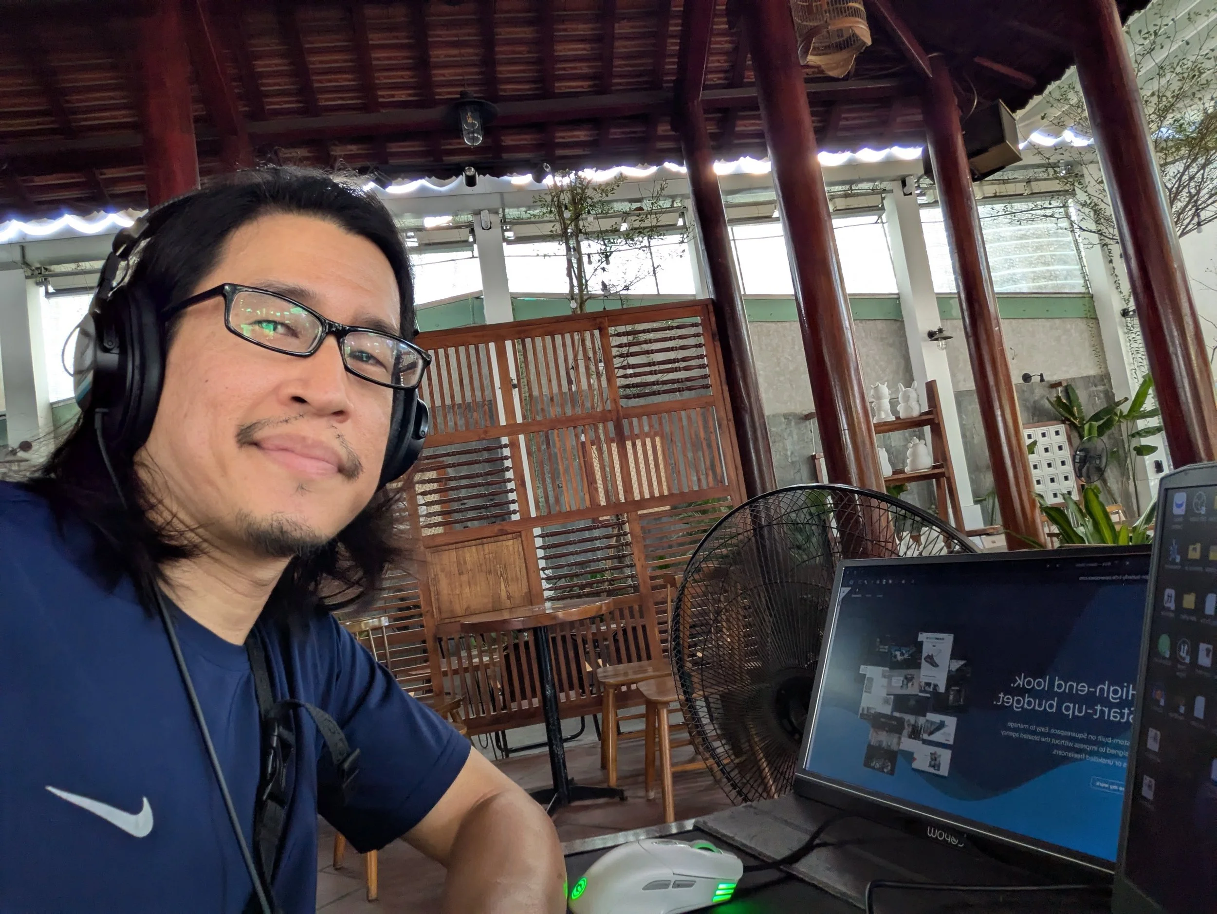 Web designer working on a laptop to implement a free website wireframe blueprint for a high-converting homepage