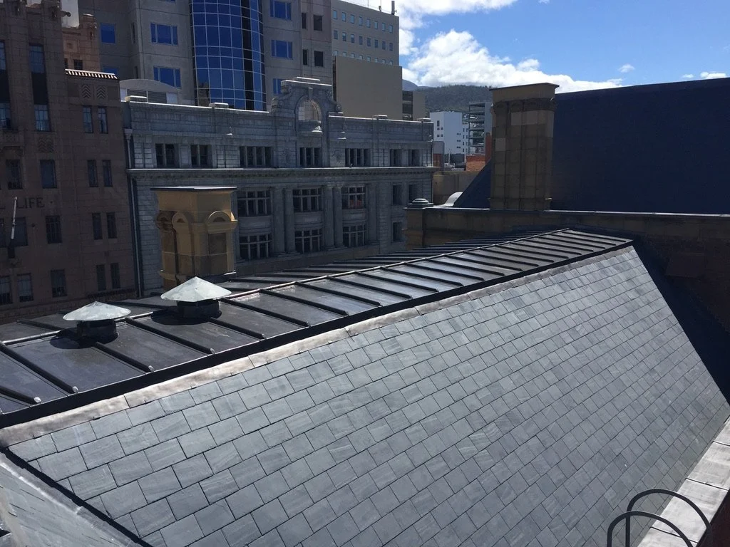 Large lead roof on top of welsh slate roof in Hobart.