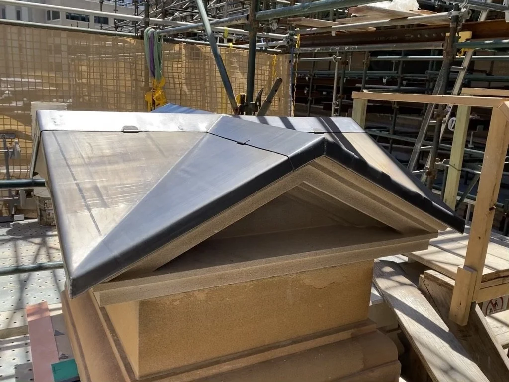 A bespoke lead weathering on pyramid shaped sandstone