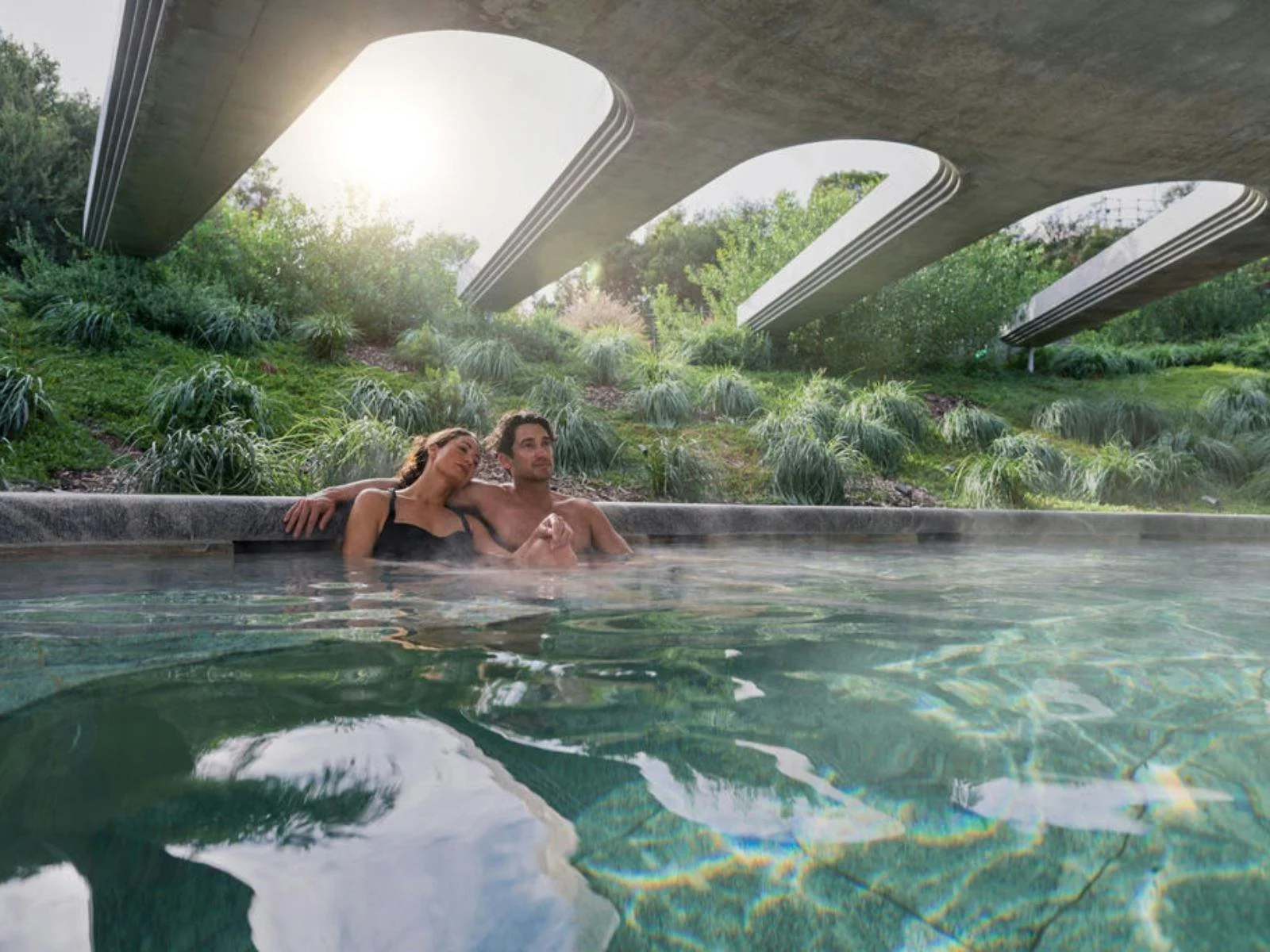 A couple relaxing at Alba hot springs.