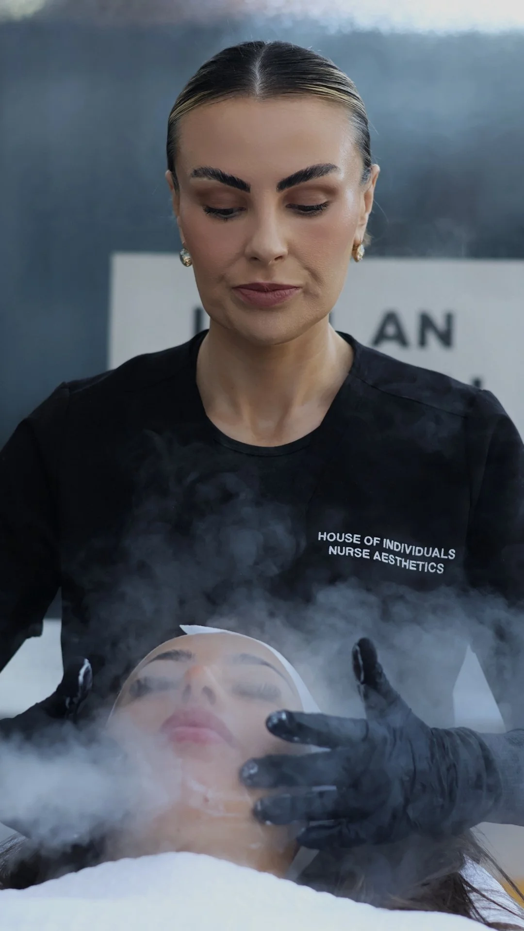 A nurse Sophie Dalby performs a hydro microdermabrasion facial treatment on a woman.