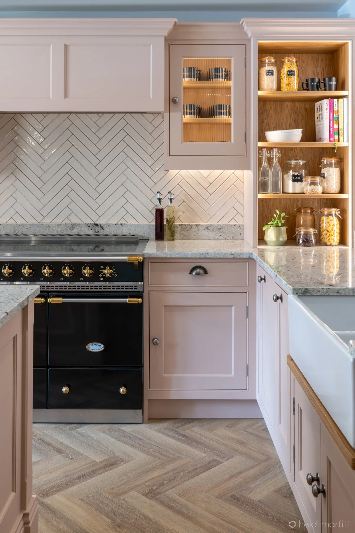 Open oak shelving with reeded glass wall cabinets compliment the look