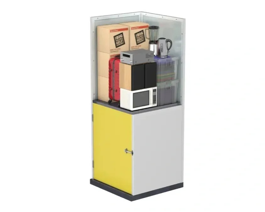 A storage cabinet filled with boxes, a red suitcase, a microwave, a black speaker, a blender, a kettle, and a plastic container.