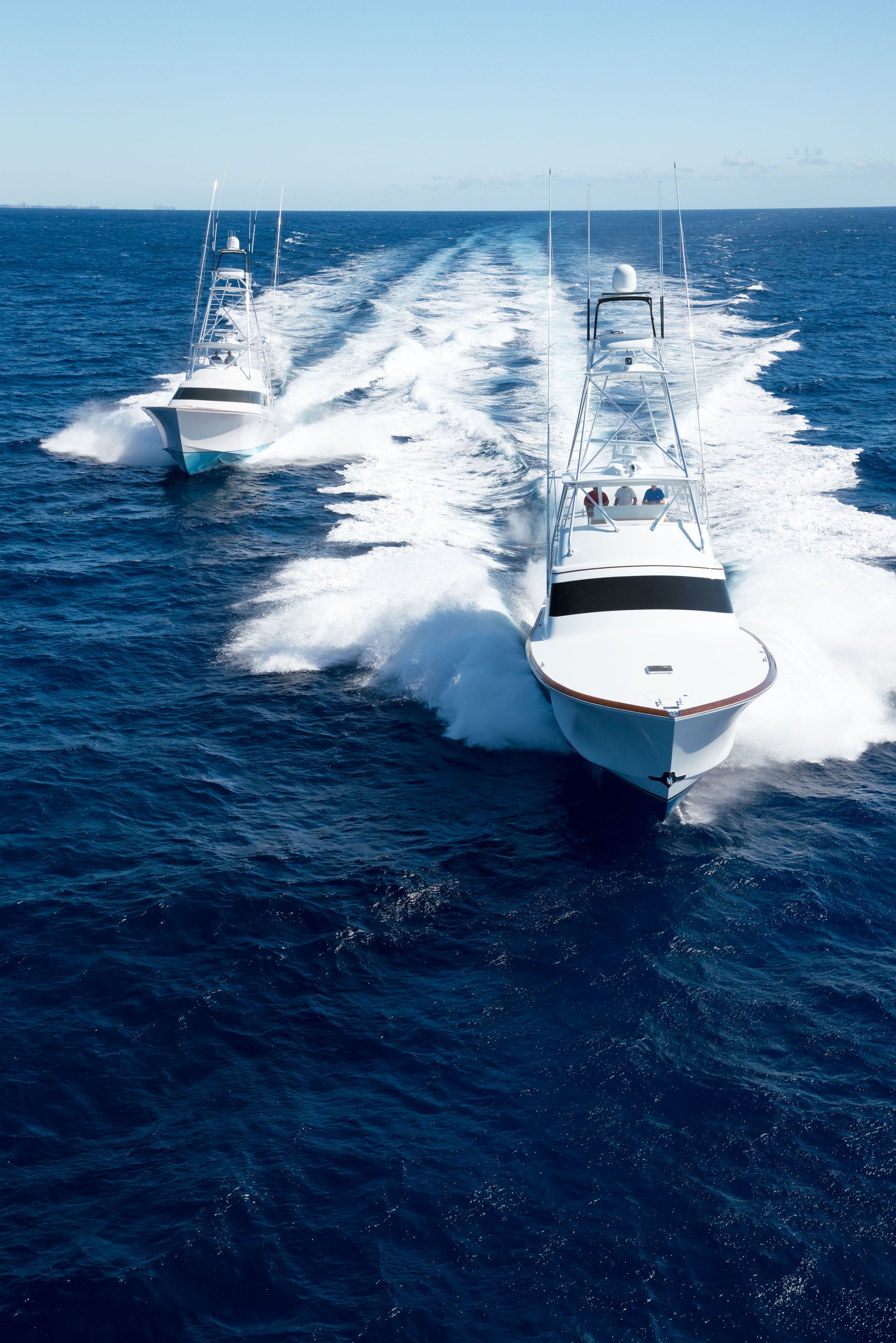 Two sportfishing yachts race to the edge off the coast of South Florida.
