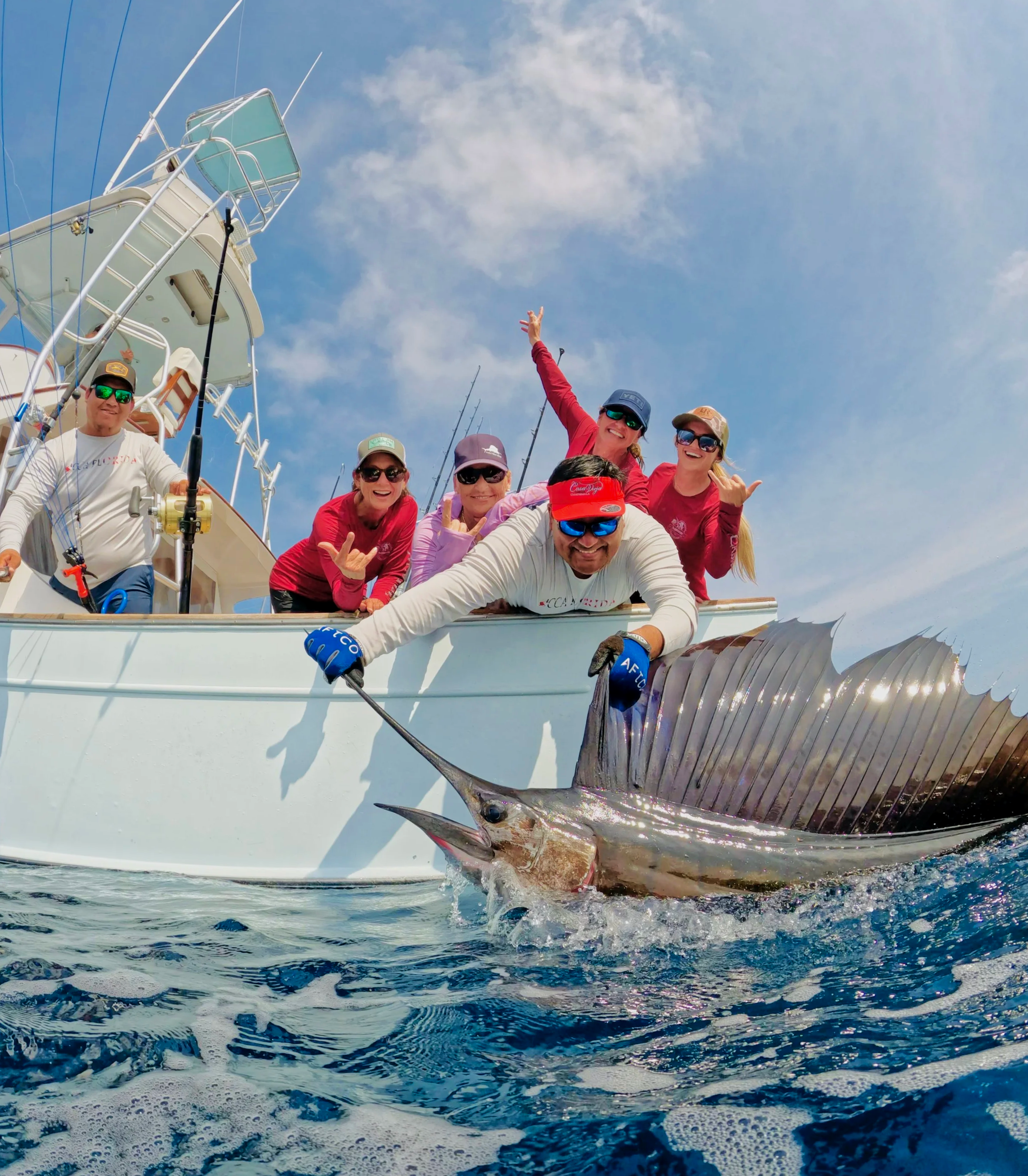 A female angling team poses with a large sailfish caught while fishing off the coast of Guatemala.