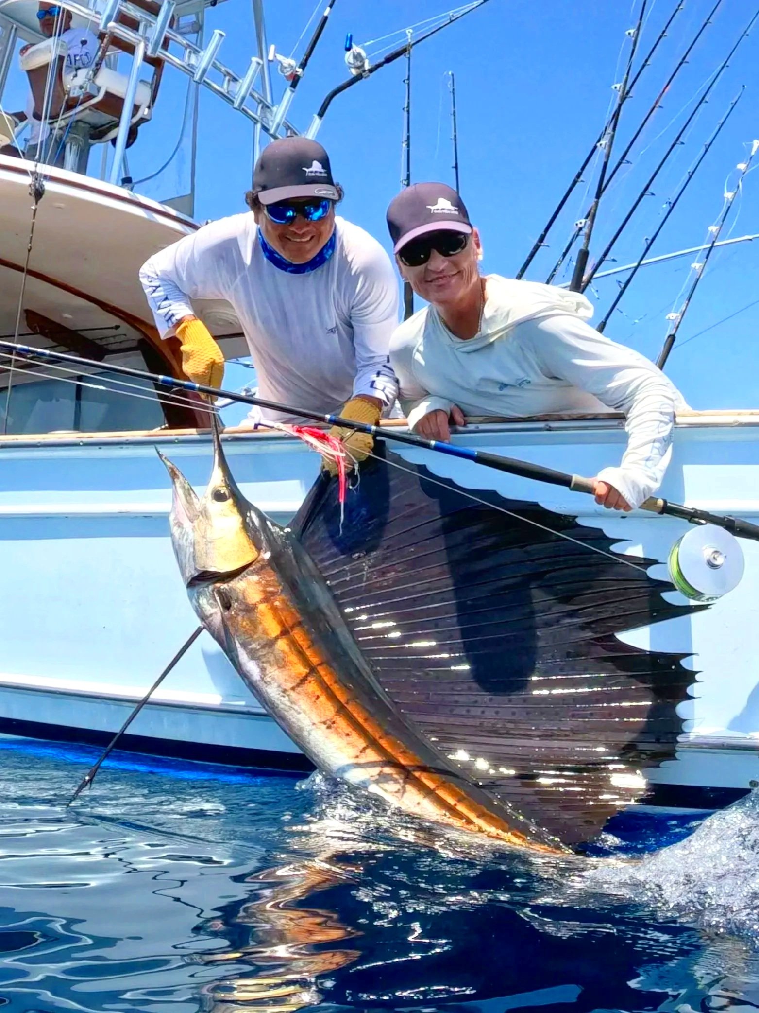 Capt. Jen Copeland poses with on of her many sailfish releases on fly off the coast of Guatemala.