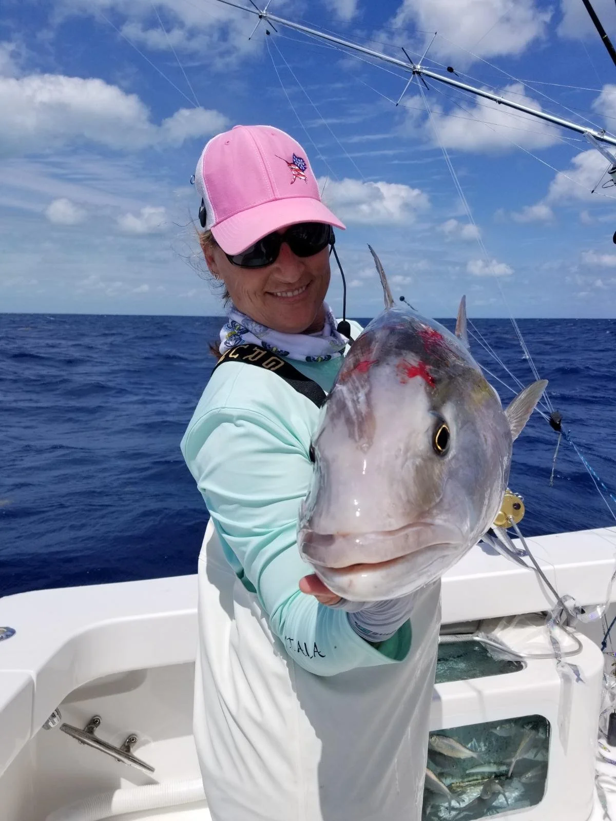 Capt. Jen Copeland holds a large jack fish, caught while kite-fishing in the Florida Keys.