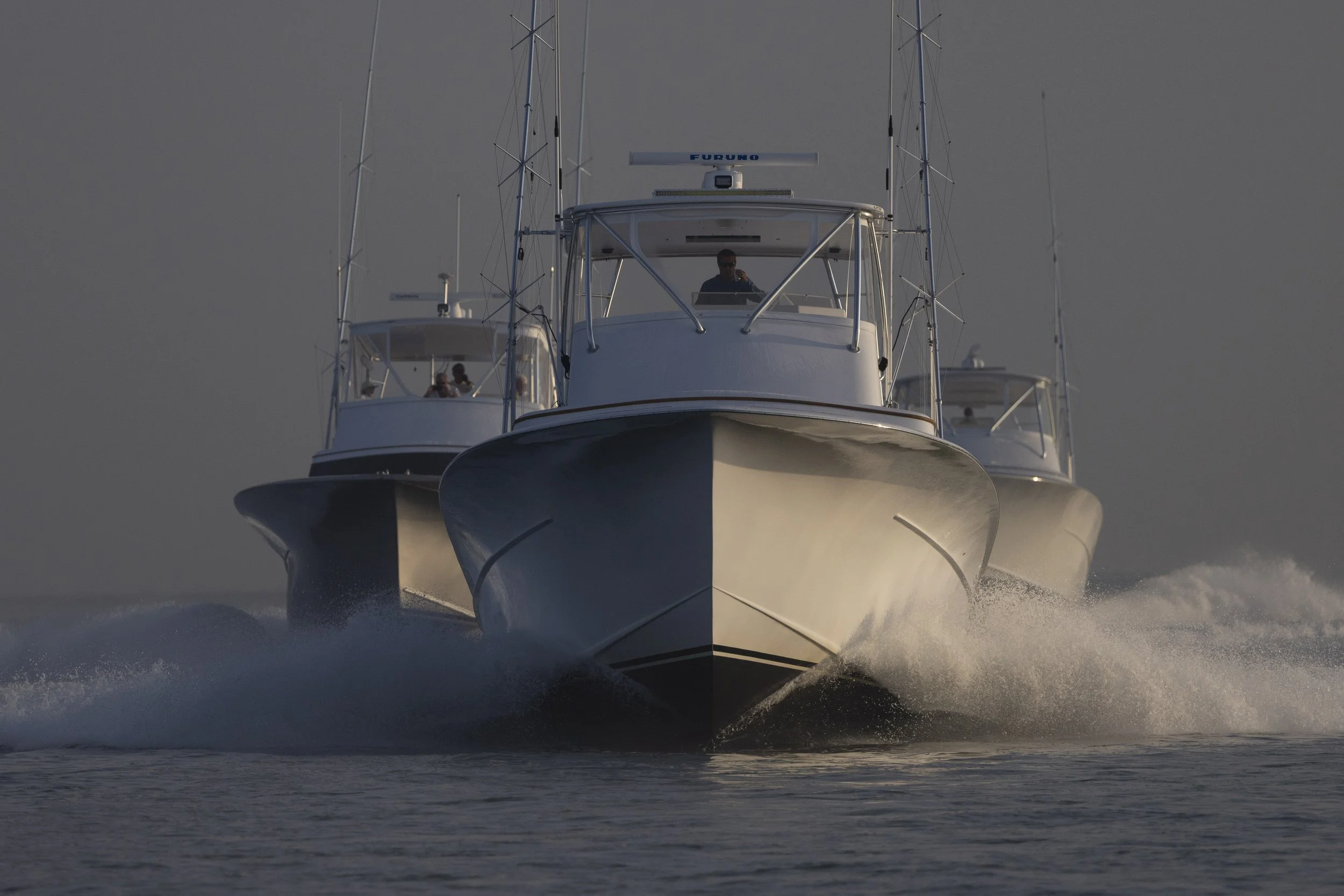 Three sportfishing yachts running to the fishing grounds off the coast of the Carolinas.
