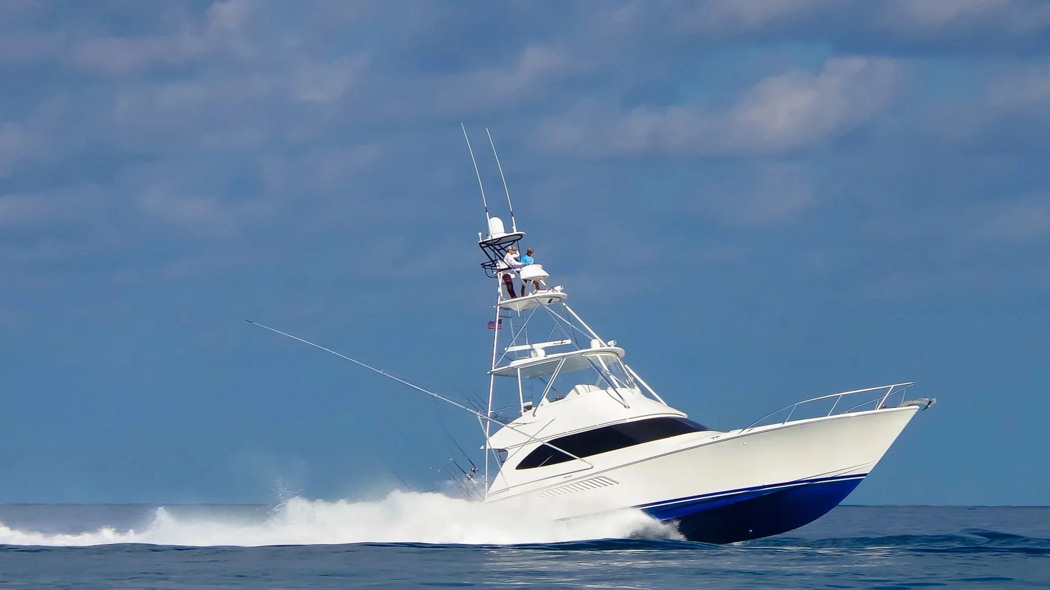A sportfishing yacht speeding on open water in the Florida Keys.