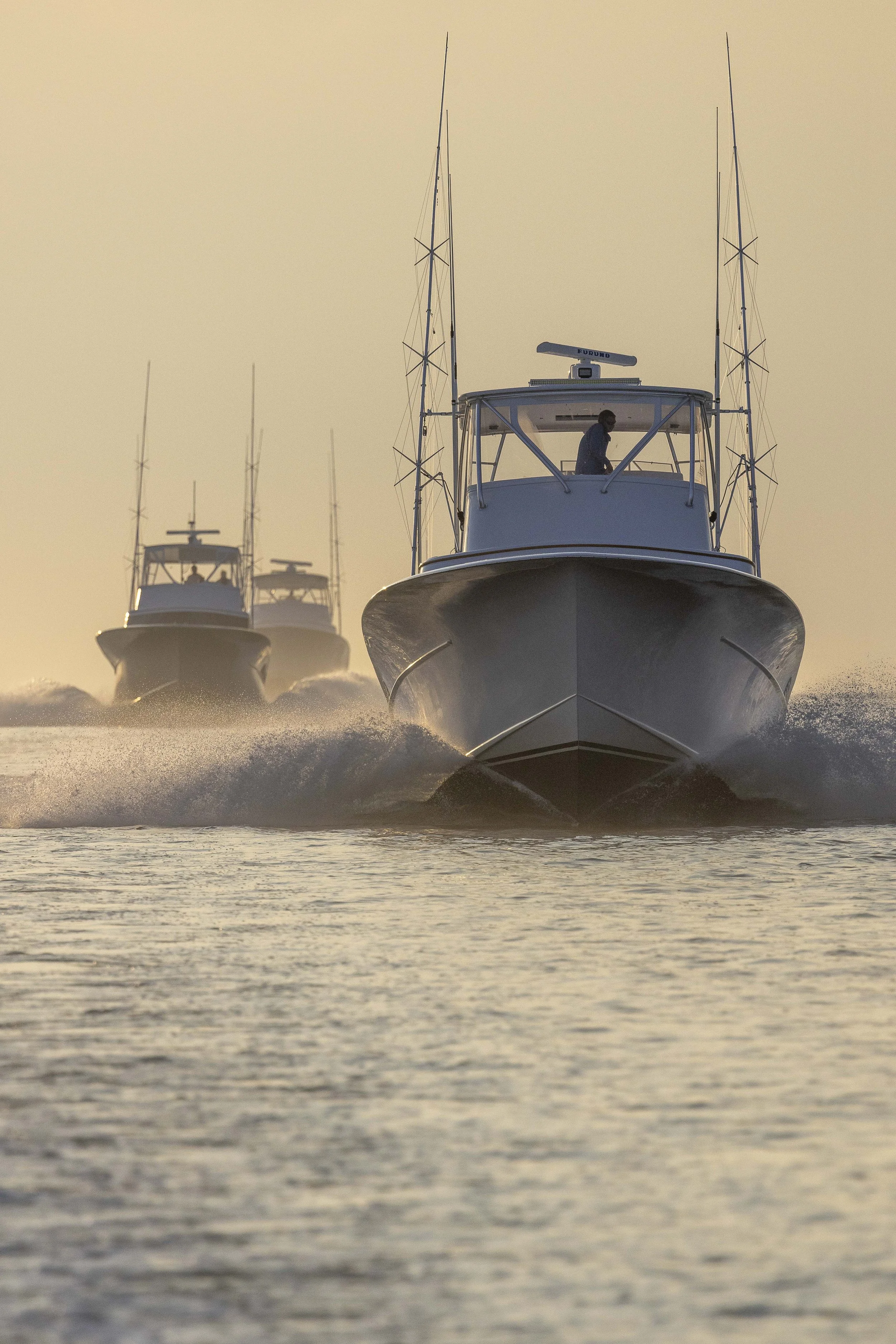 Three sportfishing yachts running to the fishing grounds off the coast of the Carolinas.