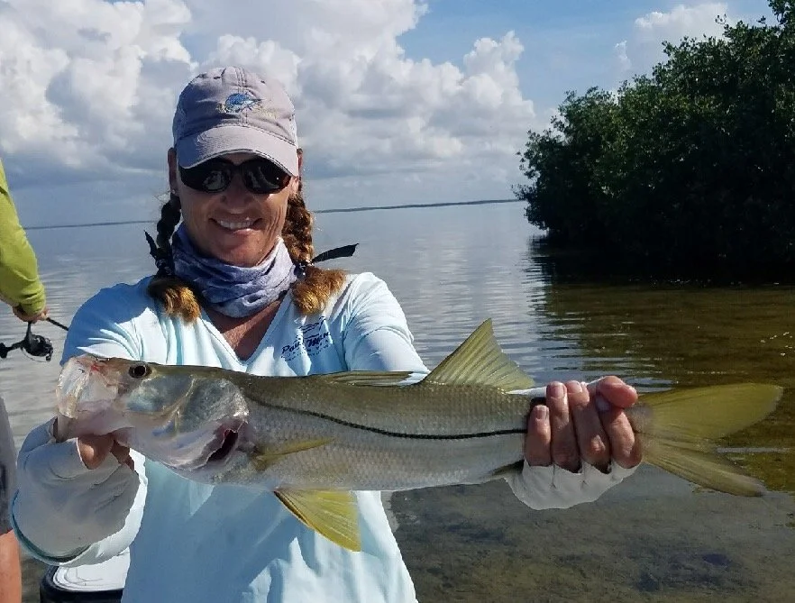 Capt. Jen Copeland holds a snook caught in the back country of the Florida Everglades.