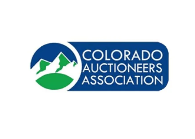 Logo of the Colorado Auctioneers Association featuring a mountain landscape with green and white peaks inside a blue circle and a dark blue rectangle with the organization's name.