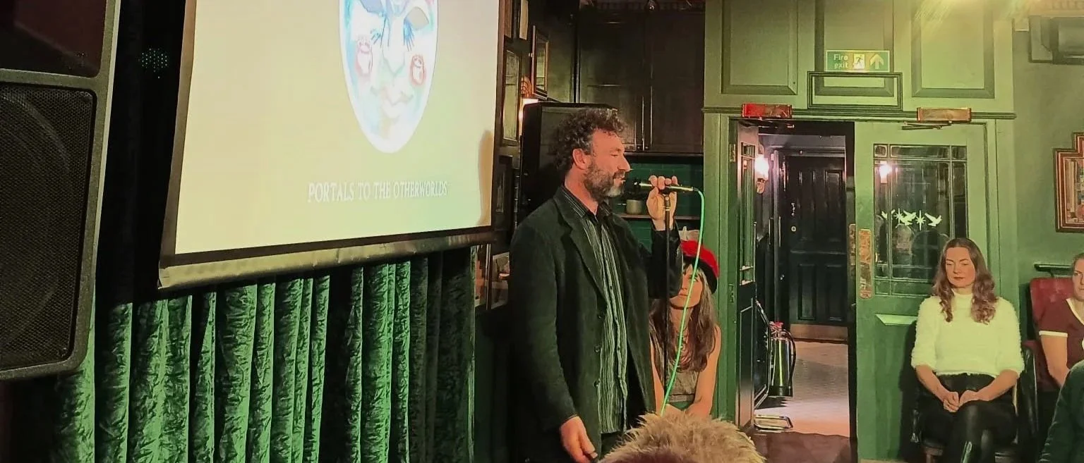 Hypnotist presenting poetry and art at a classy looking venue