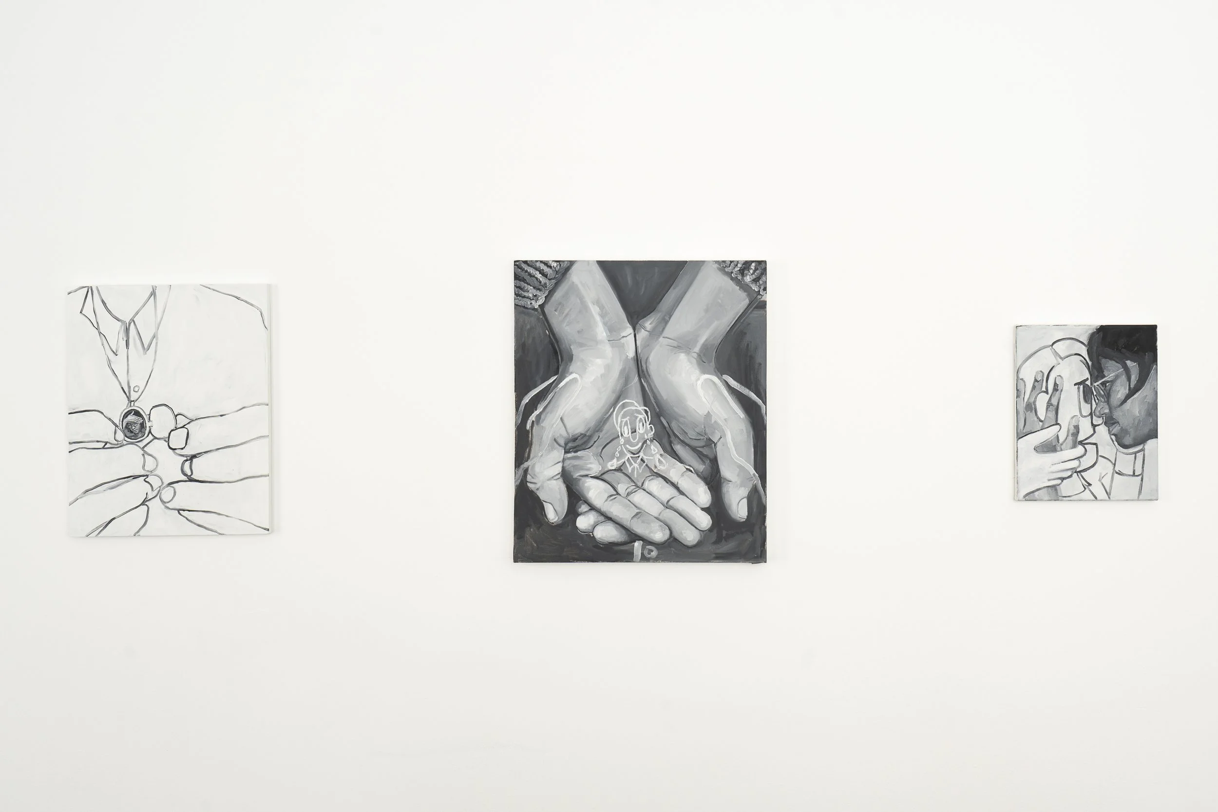 Three black and white paintings of people and hands displayed on a white gallery wall.