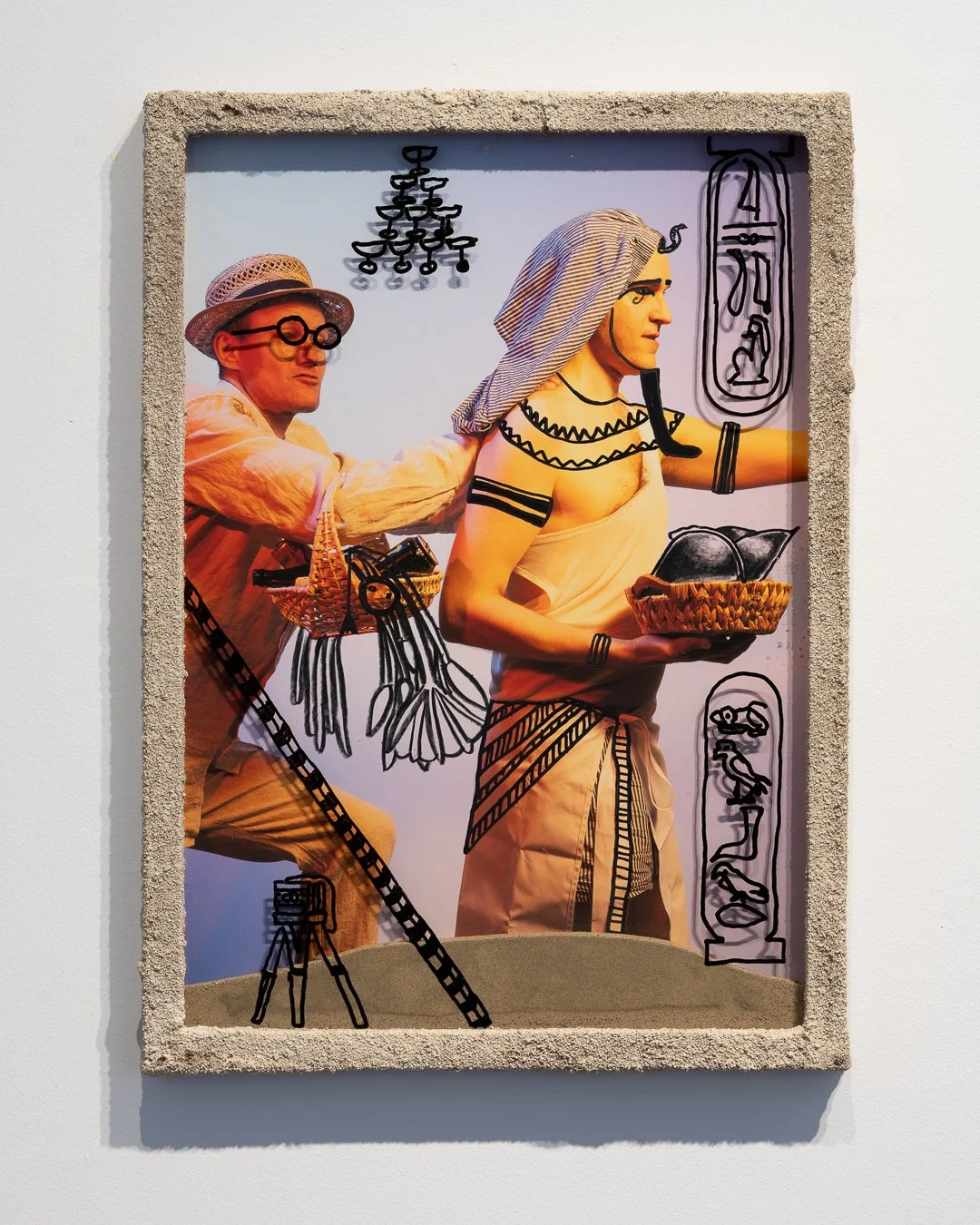  Die Leber zu Grabe tragen  Sand, glass, wood, pigment print , acrylic  45 × 33 cm (in artist's frame) 2025