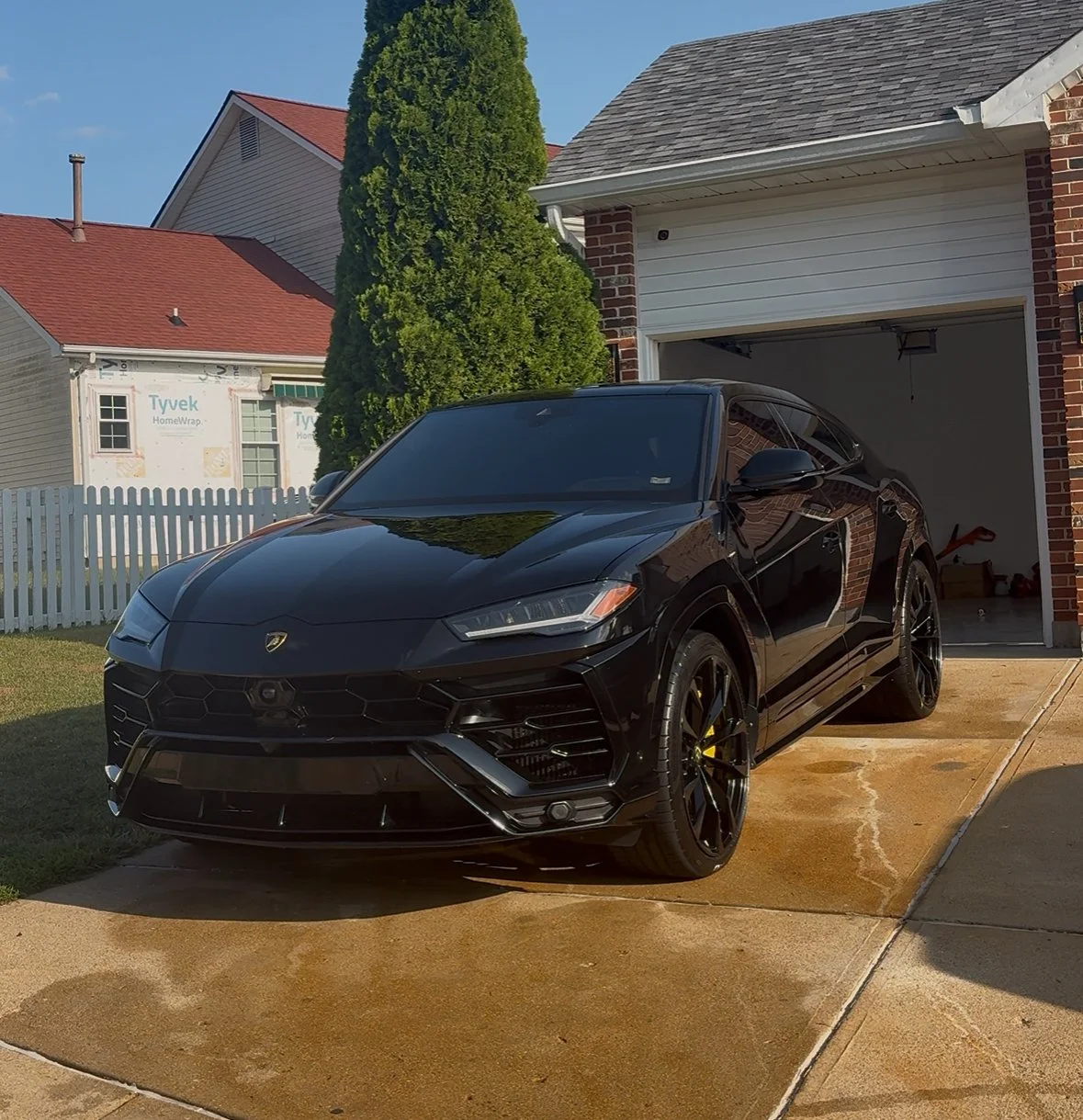 Black Lamborghini Urus receiving quarterly maintenance from David’s Auto Spa in St. Louis.