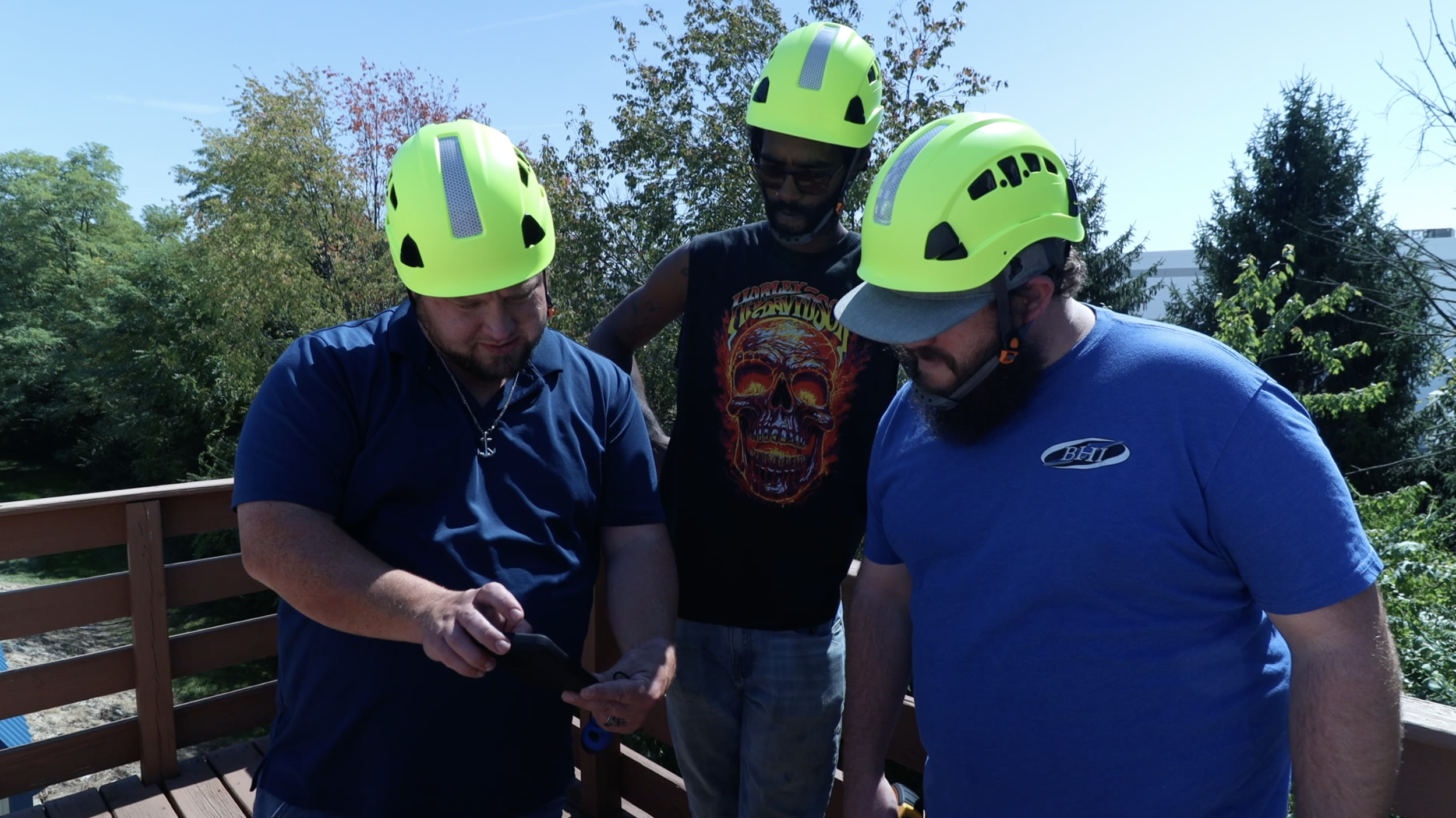 Three students looking over data