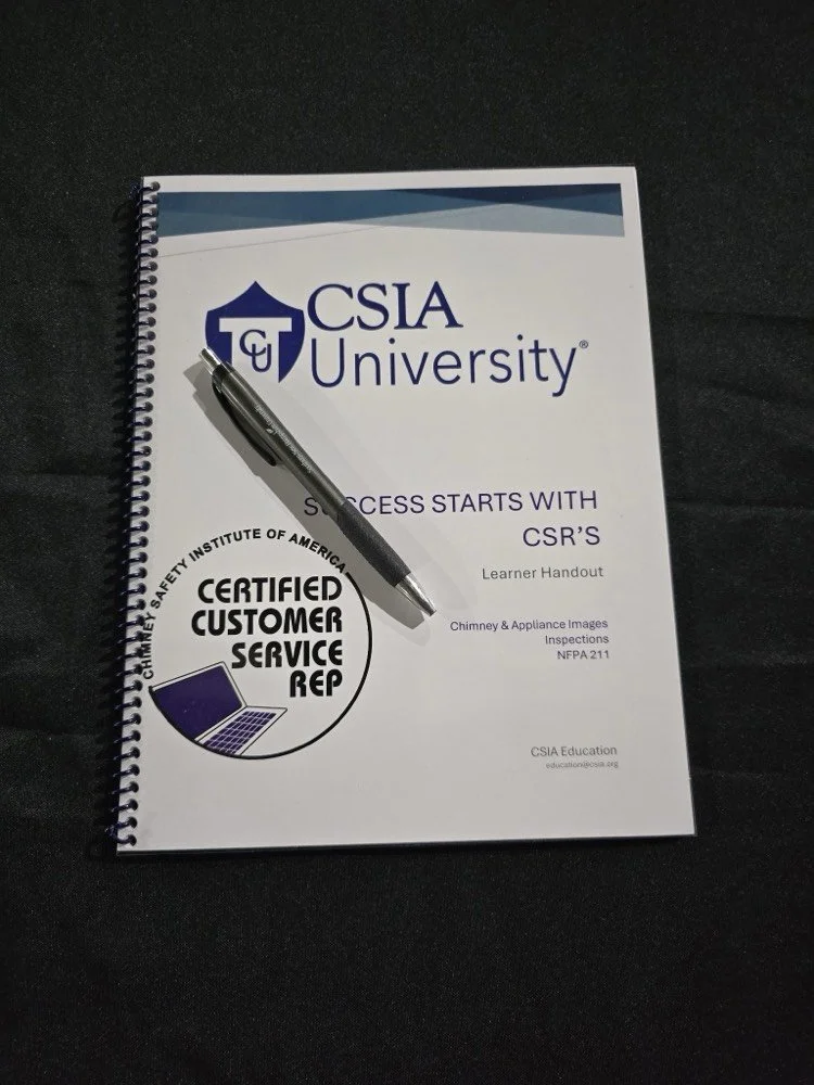 The CSIA CSR workbook with a pen