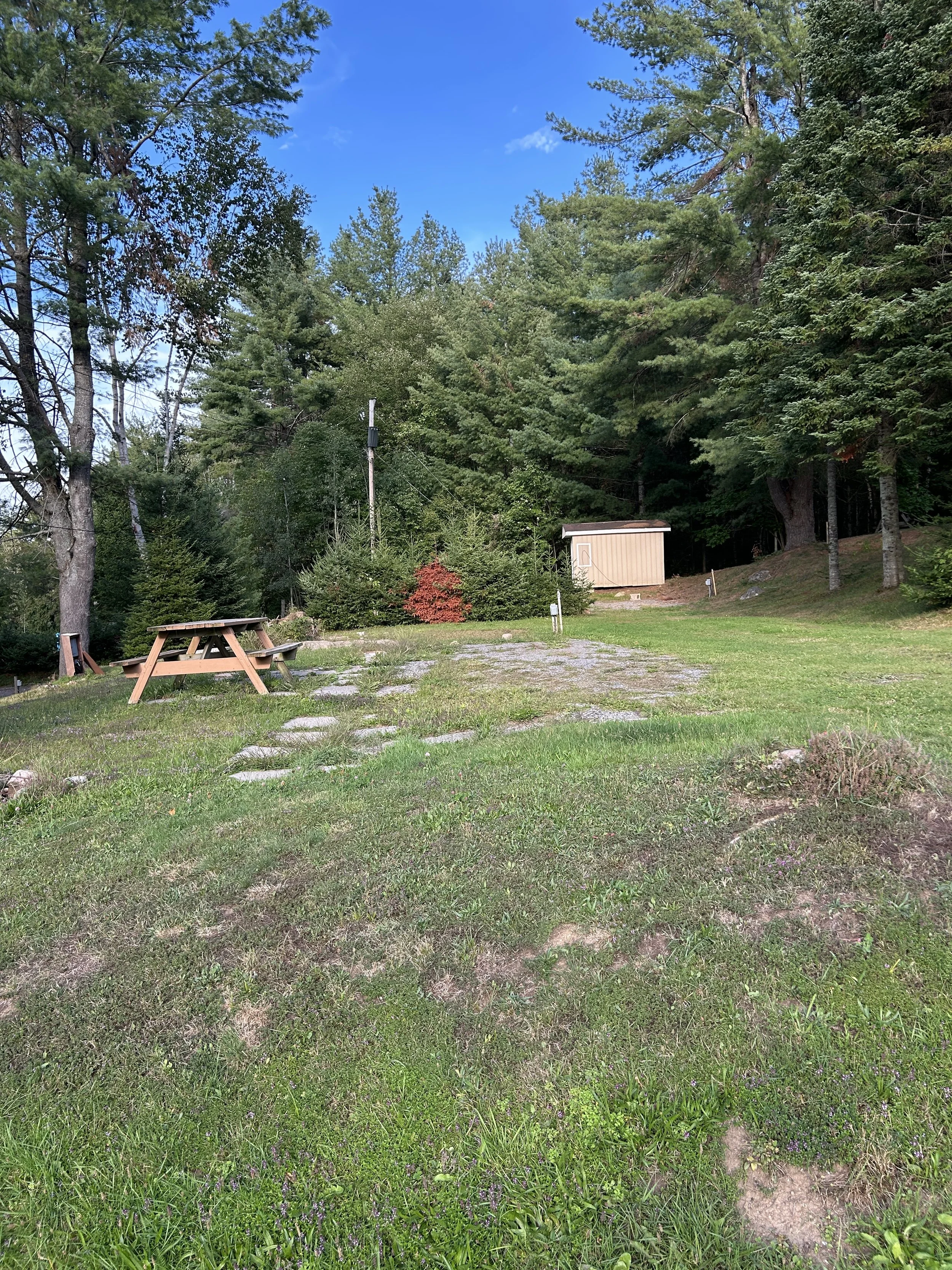 Seasonal RV site with full hook-ups and picnic table.
