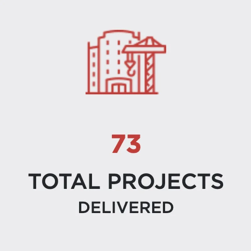 Icon of a construction site with a crane and building, text showing 73 total projects delivered.