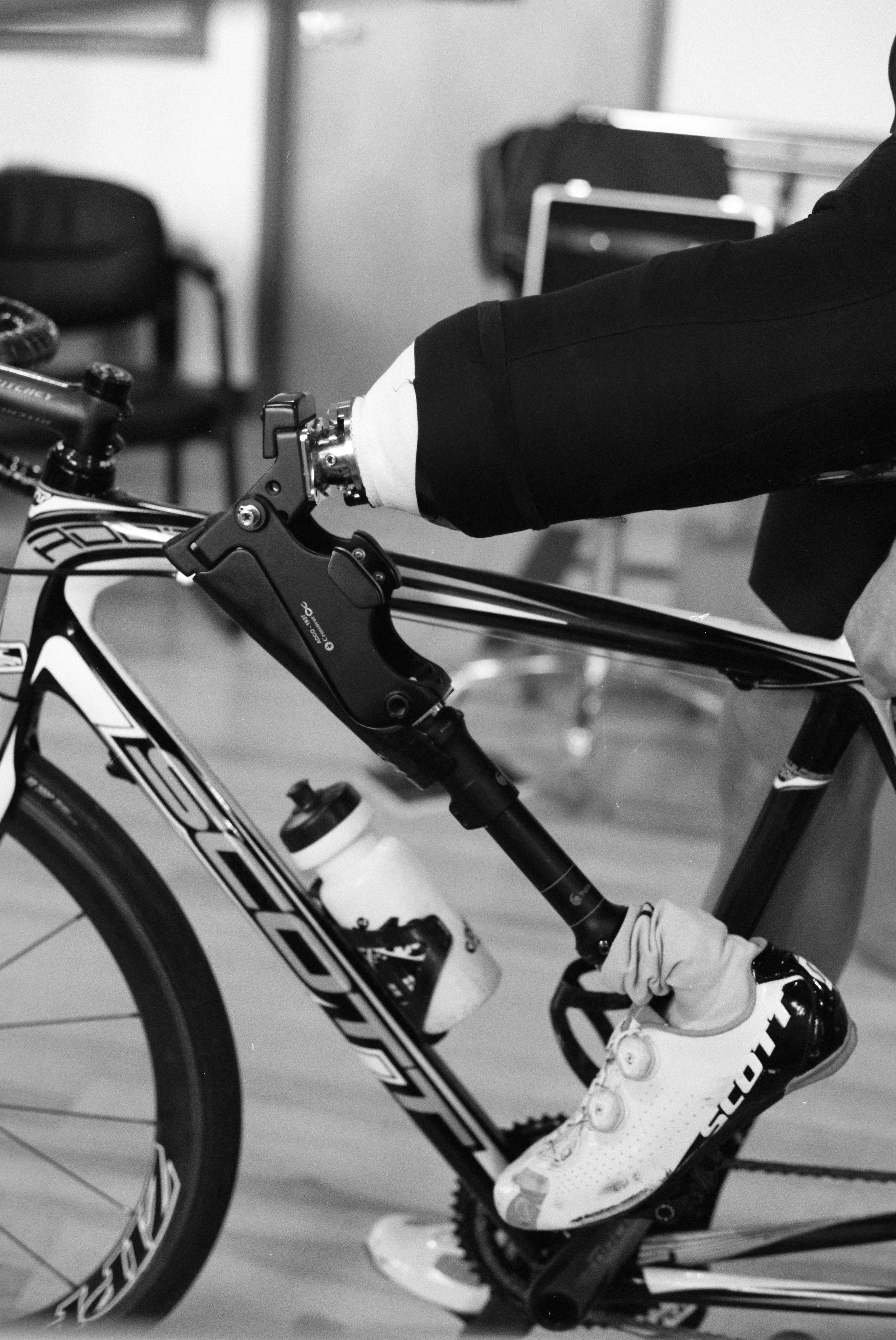 a close up of one of Dave's prostheses while on the indoor bike